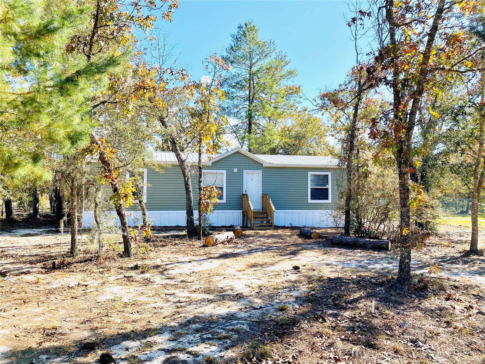 Enjoy comfort and space in this beautiful 3 bedroom, 2 bathroom double-wide mobile home set on half an acre of peaceful land. Perfectly located with privacy in mind, the property is fenced on two sides and offers plenty of room to breathe!
? Features include:
• Metal roof for durability and peace of mind
• Spacious upscale kitchen with ample cabinets and counter space
• Primary bedroom with walk-in closet
• Washer and dryer hookups for your convenience
• Open floor plan with lots of natural light
• Clean, comfortable, and well-maintained interior
No pets, please
Great rural location – quiet and serene, yet within reach of local amenities