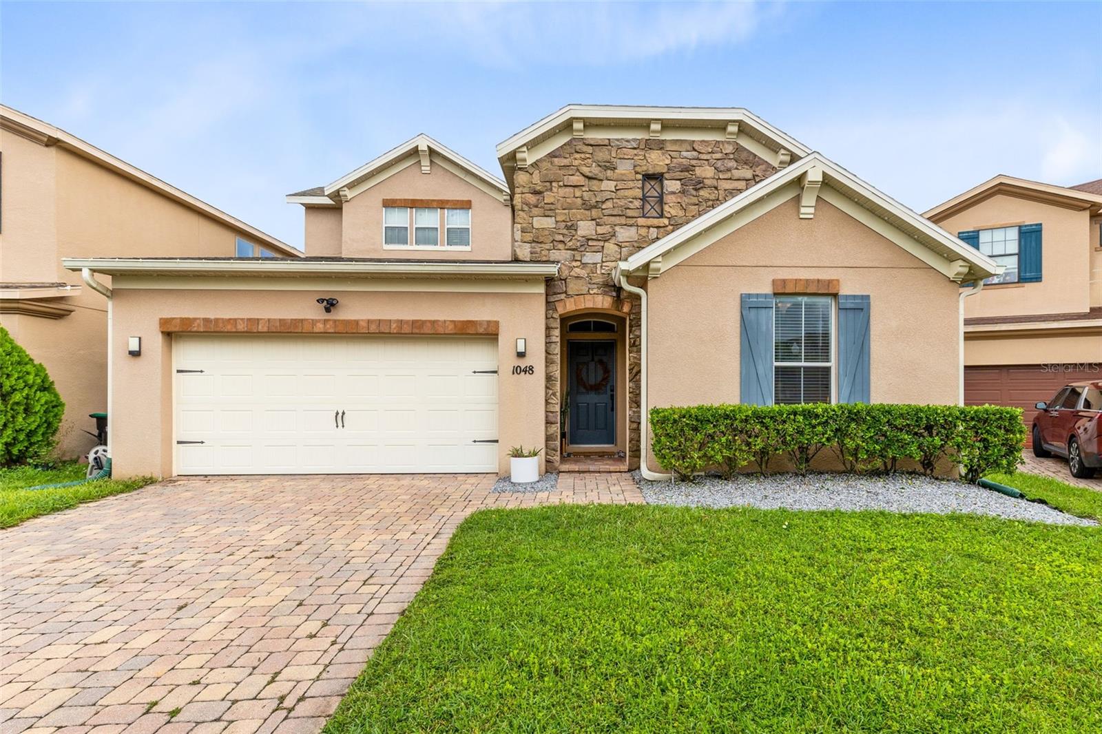 Welcome to 1048 Fountain Coin Loop, a beautiful, move-in-ready home in the highly sought-after Reserve at Golden Isle in Avalon Park. Nestled in a well-maintained neighborhood with a true sense of community, this popular Hampshire Model by Standard Pacific Homes has been thoughtfully upgraded and updated to provide the perfect combination of style, functionality, and comfort.
Step inside to find brand-new white oak wood-look porcelain tile floors, tall 5 ¾-inch baseboards, and a some freshly painted rooms that creates a bright, modern vibe. The exterior is just as inviting, featuring a newly painted front door and new Govee lighting carriage lights, for a customizable touch of curb appeal.
The heart of the home is the home chef’s dream kitchen, complete with built-in double ovens, a glass cooktop, granite countertops, a glass tile backsplash, and a spacious center island with under mount sink. The kitchen also boasts premium appliances, including an updated Samsung 4-door Flex refrigerator with Family Hub and beverage center, a newer KitchenAid dishwasher with a third rack for utensils, and a quieter, more powerful Insinkerator garbage disposal.
This flexible floor plan offers 4 bedrooms, 3 full bathrooms and a large upstairs bonus room—perfect for a home gym, media space, or playroom. The first-floor primary suite features coffered tray ceilings, triple oversized windows and an en-suite bathroom with tall countertops, dual vanities, a soaking tub, walk-in shower, water closet and generously sized walk-in closet. Architectural details like coffered trey ceilings in the dining room, built-in cabinetry, and elegant finishes throughout elevate this home’s design.
Enjoy Florida living year-round on the screened, covered paver patio overlooking a fully fenced private backyard. The home is conveniently located near top-rated schools, Waterford Lakes Town Center, Avalon Park, UCF, Research Parkway, and easy highway access (528, 408, and 417).
This home truly has it all—modern upgrades, flexible living spaces, and a prime location. Schedule your private tour today and experience why this home is the total package!