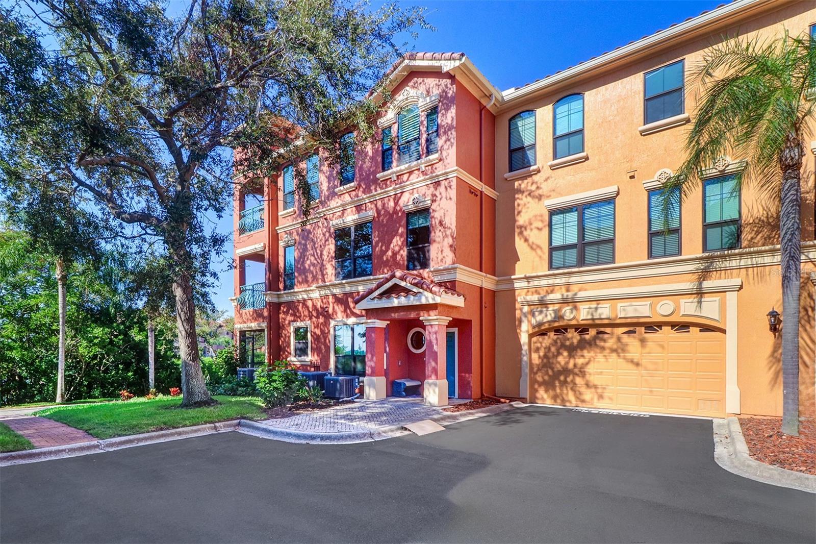 Fabulous two story "Villa San Pietro" corner townhome in the gated waterfront condominium community of The Grand Bellagio at Baywatch on Old Tampa Bay!! Mediterranean style and grace is yours as you enter through the 24-hour guard pavilion with Italian fountain to your Bellagio enclave. Features 2078 heated square feet with unobstructed water views; 3 full bedrooms, 2 full and one 1/2 baths; screened porch on first floor, terrace/balcony on second floor off primary suite; small loft for study area or small office with attached oversized two car garage. Crown molding in living, dining and family rooms, kitchen, foyer and primary suite. Kitchen has all wood cabinetry, gas stove, all stainless steel appliances, granite counter tops. Cafe plantation shutters on all breakfast nook and family room windows. Full size washer and dryer in laundry area; under the stairs storage; tile flooring throughout. Primary bedroom with gas fireplace and built-in entertainment center and small sitting area; en-suite features updated his and her separate vanities, garden tub, separate shower and a large walk-in closet. Community amenities include 6800 square foot social villa; club room; conference room; billiards room; 24 hour fitness center; geo-thermal heated pool and spa; poolside cabanas with chairs, chaise lounges, loveseats and patio coffee tables; umbrella tables and chairs; redwood sauna; 1 1/2 mile lighted waterfront promenade; tennis court, sand volleyball and playground; outdoor charcoal BBQ grills in front of each building; car care center with wash and vacuum and small area dog run. Three pavilions that are anchored at the ends and middle of the marina with a gazebo at the tennis/volleyball courts and one at "The Point" in front of Building 13 on the open waterway. The "Marina" known as "The Docks at Bellagio" is a separate condominium community under F. S. 718 with condominium boat slip fees. Boat slips can accommodate up to a 50 foot yacht; has water & electric. Currently the 3 Grand Bellagio pavilions and the common areas and boat slips in "The Docks at Bellagio" are under renovation and not available to access. Please note photos of the 3 pavilions and marina were taken prior to the renovation project and are not guaranteed to be "as built" once the renovation construction is completed. All room sizes have been measured for the floor plan in the photos but are deemed to be approximate. NO AIRBNB - NO SHORT TERM RENTALS. The Grand Bellagio is designated by the City as a "residential condominium community" with a minimum rental period of 7 to 12 months. Purchase your Florida resort home today.....