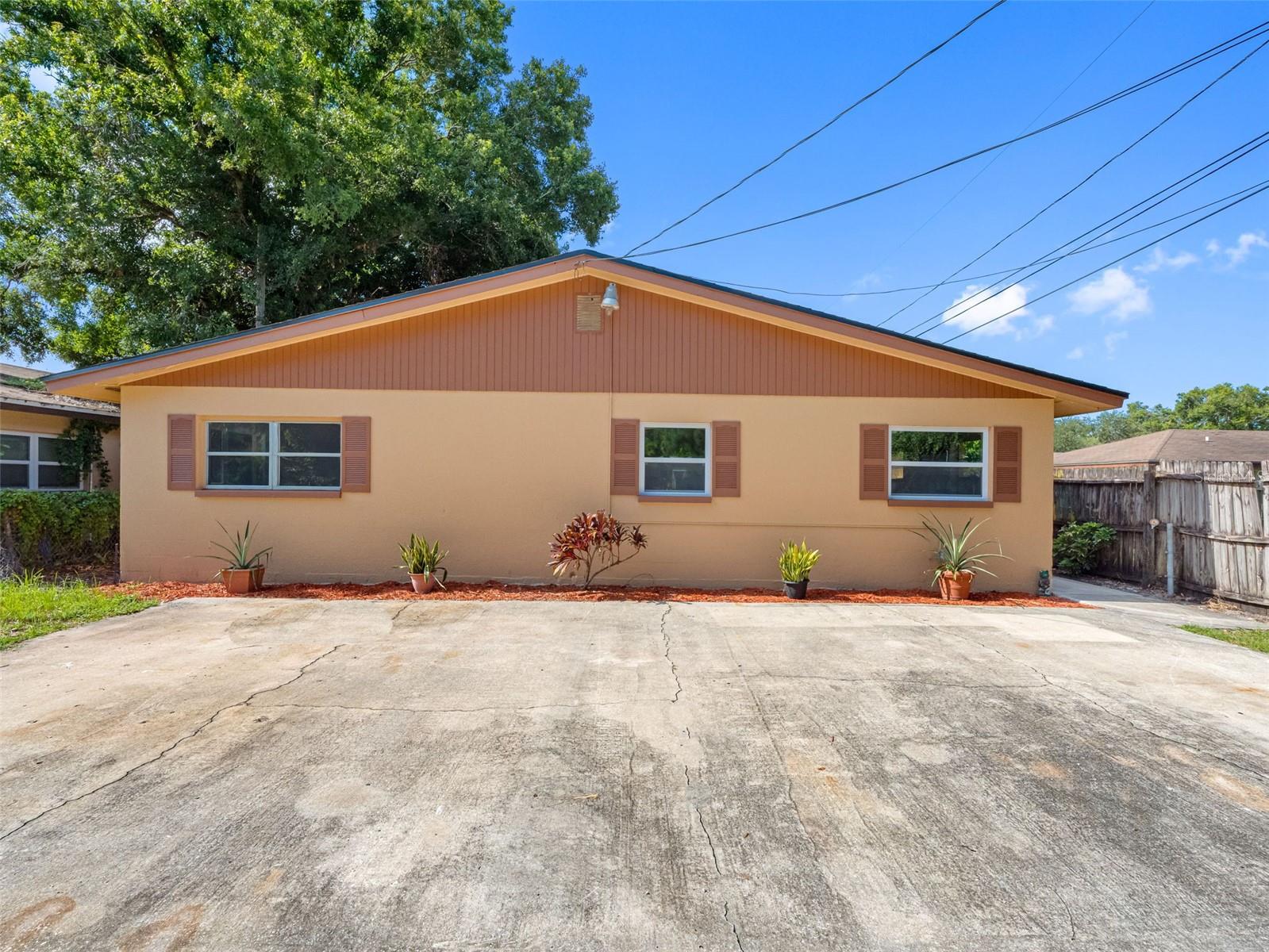 One or more photo(s) has been virtually staged. Fantastic turnkey duplex in a prime Largo location just north of Ulmerton Road, offering two spacious 2-bedroom, 1-bathroom units, each with nearly 1,000 square feet of living space. Both units feature brand new central AC systems installed in June 2025, a new shingle roof also from June 2025, two new electrical panels, all new ductwork, insulation, kitchen cabinets, flooring, and appliances, totaling over $83,000 in recent upgrades. Most of the windows in both units have been replaced with new ones valued at $10,000. Each unit has its own keyed entry and parking for two vehicles, and both share access to a dedicated laundry room with washer and dryer hookups located at the back of the building. The large fenced backyard is shared and ideal for pets or outdoor living. Both sides are move-in ready and expected to rent for $1,500 or more per month, making this a great investment opportunity or perfect for an owner-occupant looking to offset their mortgage. One of the largest duplexes in Coral Heights of Largo, this solid income-producing property is conveniently located near shopping, dining, schools, airports, and the Gulf beaches, and checks all the boxes.