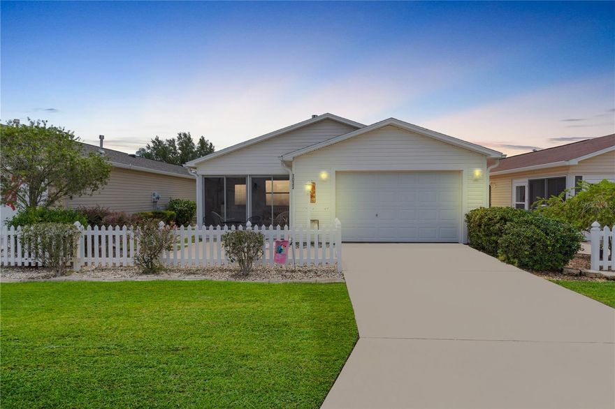 Are you looking for a patio villa in close proximity to Lake Sumter Landing? Look at this beautiful colony patio villa in the Oleander villas in The Village of Sabal chase! As you approach this home take note of the manicured lawn with a decorative picket fence.  Upon entering the home, you will notice laminate flooring throughout.  There is a spacious living room and dining area with ceiling fans and updated lighting. The eat in kitchen with a pony top counter boasts of granite counters with white cabinetry, updated lighting, and newer black stainless appliances (2019). The master bedroom features ensuite bath with shower, white cabinetry and granite counters, laminate flooring, and ceiling fan. The guest bedroom offers ample space with laminate flooring and ceiling fan. The guest bath features white cabinetry with tub/shower combo and granite counters. Roof 2011 and A/C 2017. The Village of Sabal Chase is close to the Lake Miona Regional Recreation center and Mallory Hill Country club. The Sabal Chase neighborhood recreation center is a great place to meet friends. Dining, shopping, movies and free entertainment are nearby at Lake Sumter Landing.