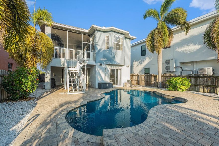 This gorgeous waterfront pool home would be ideal as a primary, second home, or investment property! Truly a boater's paradise Ready to live the good life? Live the Apollo Beach lifestyle where others go to vacation or let it bring cash flow. This updated bi-level pool home delivers open, light-filled living upstairs with an updated kitchen (wall oven, cooktop and hood, center island, snack bar), a large dining area for holiday gatherings, and an oversized family room that opens to a screened balcony for sunset cocktails. The primary suite features balcony access and a resort-style bath with dual sinks, walk-in shower, and soaking tub. Two additional bedrooms, a well-appointed guest bath, and interior laundry complete the upper level. Downstairs, a versatile air-conditioned bonus level adds a kitchenette, game/TV areas, bar/dining space, and guest sleeping options, all flowing out to your private backyard oasis: heated pool, multiple lounging zones, and a tiki hut for easy entertaining. Boaters, bring the toys. Your private dock with 10,000 lb lift sits on sailboat-depth water with direct, no-bridge access to Tampa Bay. Head out in minutes and be home for dinner. This is truly a peaceful retreat and is perfect for multi-generational families. Practical considerations include the metal roof and elevated home style. Apollo Beach is a prime location as it offers parks, trails, markets, marinas, waterfront dining (some steps to this home), the Manatee Viewing Center and is centrally located to Tampa, St Pete & Clearwater, Bradenton, Sarasota, and Orlando. What are you waiting for?