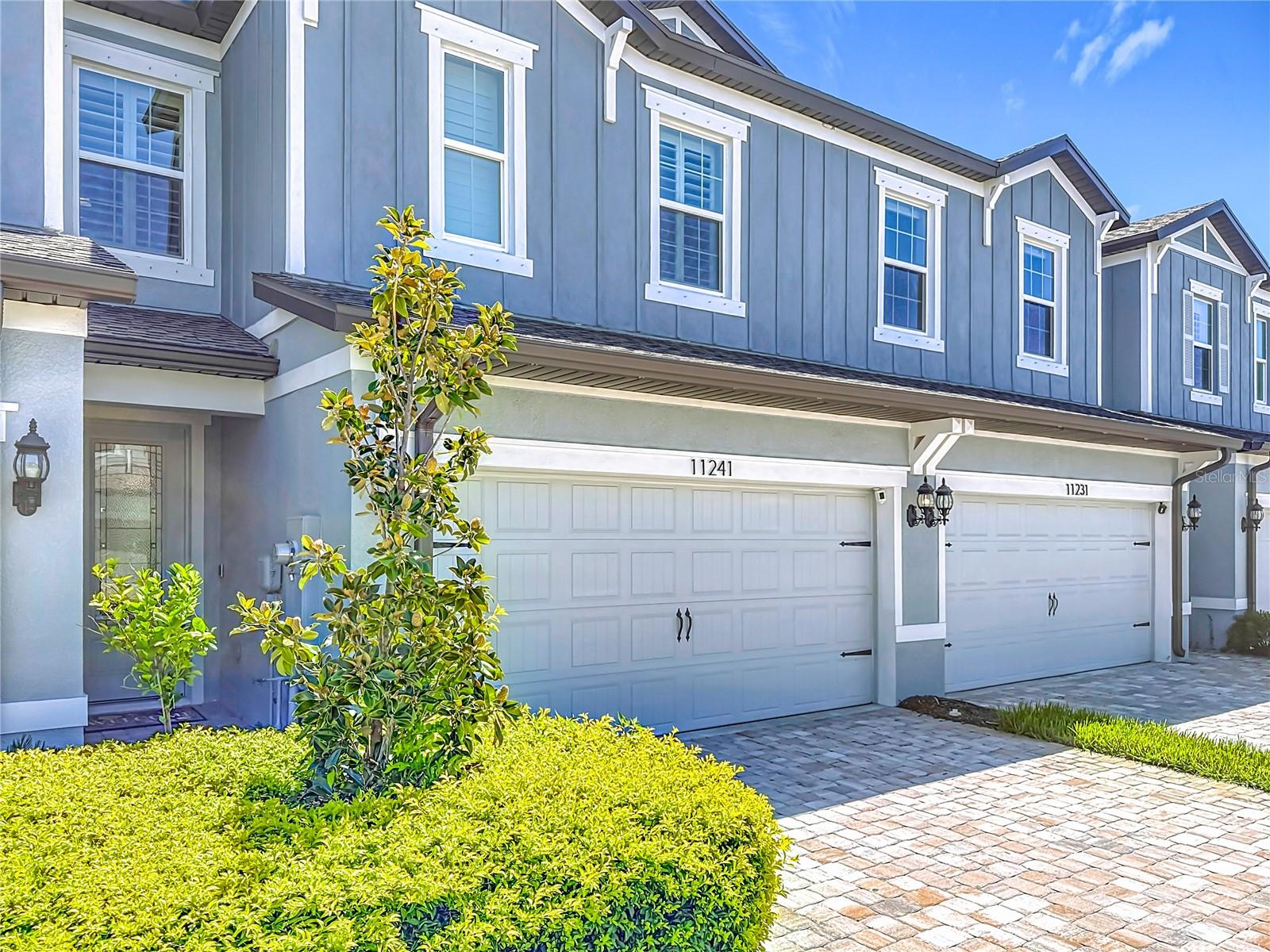 LIKE NEW SPACIOUS TOWNHOME in the gated community of Shoreline! Natural light throughout with plenty of windows and AMAZING views of your pond in the back! High ceilings, beautiful tile flooring, recessed lighting, Plantation shutters, and the kitchen is a dream with QUARTZ countertops, kitchen island for entertaining, 42" upper cabinets, stainless steel appliances and PLENTY of cabinet and counter space. Kitchen has a nice sized pantry too! Large storage space under the stairs and coat closet as you come in. Open floor plan concept! Enjoy your peace and quiet with views of the pond in your covered and completely screened in lanai with door to step outside! Primary bedroom is large in size and features a massive walk in closet with a custom closet system to stay organized. Laundry room is conveniently located on the second floor and the 2 extra bedrooms are large in size with plenty of closet space. LOW HOA covers SO MUCH! Maintaining the exterior, grounds, WATER, TRASH AND SEWER! This gated community is pet friendly with its own dog park just a few steps away. Location is ideal and close to downtown St Petersburg, downtown Tampa, airport, beaches and so much more! Home is turn key and move in ready.
