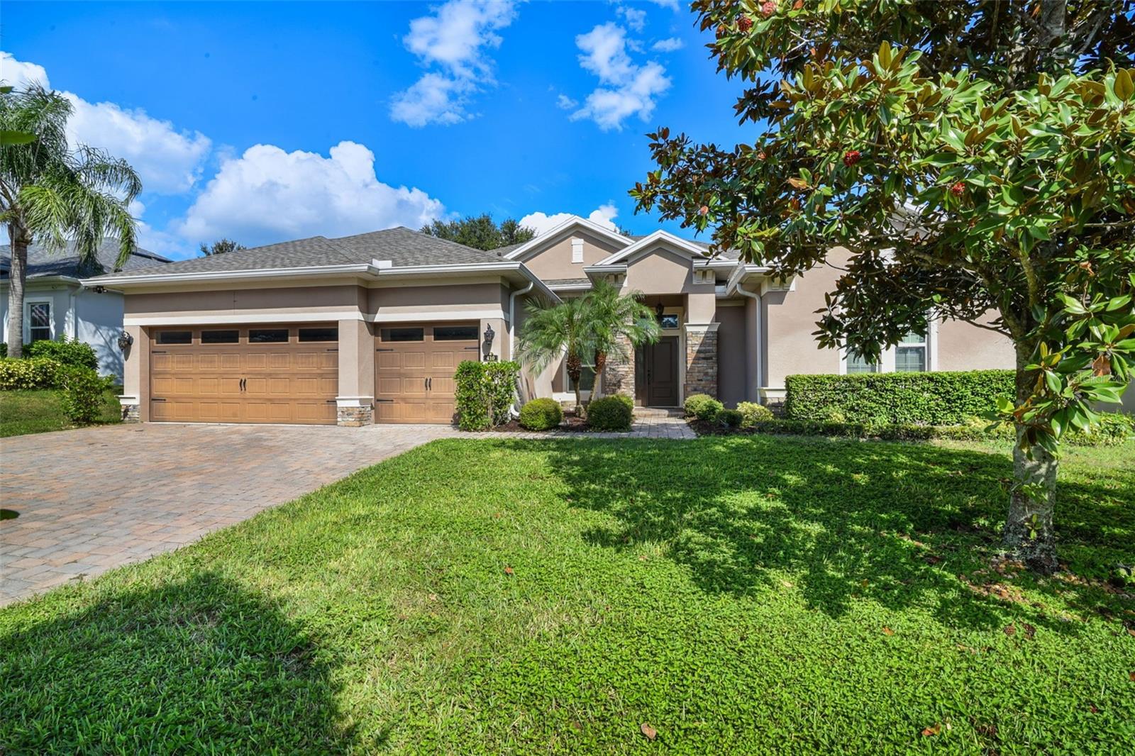 Located in a rare natural gas community, this updated home with 3 car garage and paver driveway offers 4 bedrooms, a private office, and an upstairs media room—the only room on the second floor. New tile flooring has been installed throughout the main living areas, with brand-new carpet in all bedrooms and the media room.
The kitchen features a built-in double wall oven and a range with a third oven. Appliances are currently electric, but the home is pre-plumbed for a gas range, gas water heater, and gas dryer. Washer and dryer are included.
The media room includes built-in cabinetry and comes fully equipped with a projector, screen, sound system, and furniture. Outside, enjoy an extended screened-in lanai with an upgraded tall screen ceiling. A backyard playground is included, along with a Ring security system.
Located in a quiet neighborhood, this move-in ready home offers space and thoughtful upgrades throughout.
