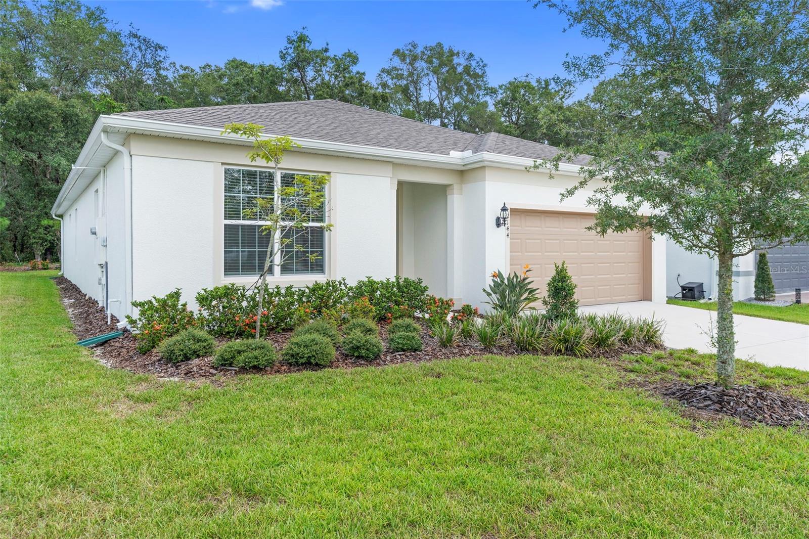 Seller is MOTIVATED and offering a 3% CREDIT toward buyer closing costs and prepaids with an acceptable contract. This nature lovers delight has a beautiful wooded view with NO REAR neighbors and has been meticulously maintained. Built in 2024 by Pulte Homes this Spruce Model offers 3 bedrooms, 2 bathrooms, and a large FLEX ROOM—perfect for a home office, playroom, or guest space. With over 2,100 square feet of living space, this home features an open-concept kitchen, dining, and living area that’s perfect for entertaining. The kitchen is a standout, offering elegant 42" upper cabinets, sleek quartz countertops, a large island, and plenty of workspace for cooking and gathering. Step outside to a generously sized covered lanai with a peaceful wooded view—ideal for morning coffee or evening relaxation. The private primary suite is tucked away at the back of the home and includes a large walk-in closet, dual vanities, and a luxurious tiled walk-in shower. Located in the desirable Canopy Terrace community on the southeast side of DeLand, you're just minutes from I-4 exits 114 and 116, 10 minutes to historic Downtown DeLand, 35 minutes to New Smyrna Beach, 40 minutes to Downtown Orlando, and about an hour to major attractions like Disney and Universal. Don’t miss your opportunity—schedule your showing today!