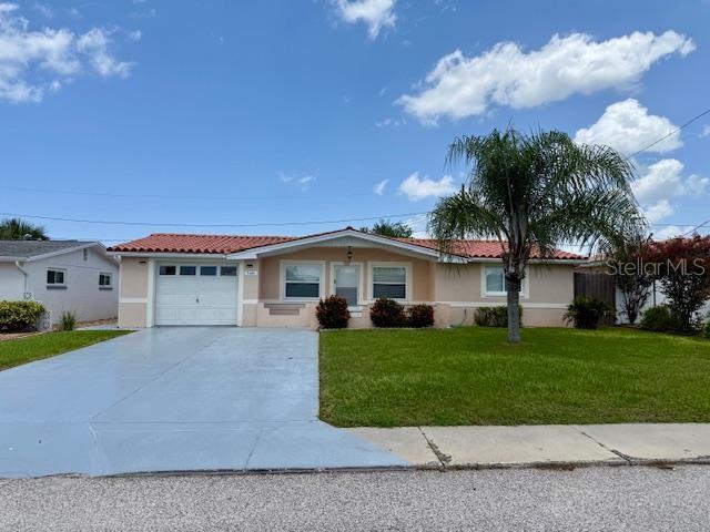 Beautifully remodeled & updated 3 bedroom 2 bathroom home at 1128 square feet located in the Colonial Hills subdivision with a fenced in yard. Open & spacious floorplan with a large size Living Room. The kitchen has black appliances, granite countertops, wooden cabinets & an eat in space. Nicely sized bedrooms with ample closet space. Both bathrooms have been updated & look fantastic! There is laundry room located inside the 1 car size garage with washer & dryer hooks ups and a laundry tub. Enjoy relaxing on the screened lanai. Newer vinyl laminate flooring throughout the home. Pets allowed. This home is minutes away from shopping, restaurants, schools and the beaches. Clearwater Beach & Tampa Bay International Airport is about 40 minutes from the home. World famous Tarpon Springs Sponge Docks and Beautiful Howard Beach is about 10 minutes away. This home is a must see!