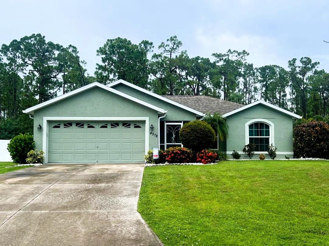 This Lovely & Charming Home Awaits You!! As you are walking towards this home you will notice the exquisite curb appeal and mature landscaping design and you will immediately experience a welcoming feeling! This home offers an Outstanding Layout with an open kitchen to the dining room area providing an inviting atmosphere for your family & friends to gather & celebrate! This home will captivate you with its unique features offering over 1890 of total square footage, three bedrooms with sizeable closets, two comfortable bathrooms with linen closets, inside laundry room with cabinetry, two car garage with a side door access, screened entrance porch & back lanai, suited with a generator hookup, hurricane fabric protection for the garage door, shed in backyard for your extras! The Kitchen Overlooks the Pool Area and is well equipped with stainless steel appliances, a great closet pantry and a breakfast bar! The Backyard with the Aboveground Pool & Outdoor Garden feels like a Tranquil Oasis, completely fenced for privacy with a beautiful vinyl fence! Well Maintained with Upgrades/Updates which include pest control preventive care, new water heater-2025, newer HVAC system-2024, aboveground pool-2020, luxury vinyl plank flooring-2020, gutters-2020, water softener system-2018, insulation added-2019, roof-2016, impacted windows-2018/2019 except for the kitchen window & sliding glass door which both will be protected by the lanai shutter! Located in a desirable and growing area of North Port near new construction homes, hospitals, pharmacies, supermarkets, shopping centers, restaurants, parks & US-41! Quick Access to I-75 is absolutely a plus! Approximately 20-25 minutes away from this home you can find **The Charlotte Sport Baseball Stadium is Home Field for Tampa Bay Rays Spring Training **The Downtown Punta Gorda for upscale waterfront dinning, marinas & live entertainment *The Sunseeker Resort & **The Punta Gorda Airport being home of the FL International Air Show & offering flights by Allegiant Air to 51 destinations!! Buyer is to verify all information pertaining to this home & listing.
**This Home Is One of a Kind... Delightful & Immaculate...Schedule Your Showing Today **
