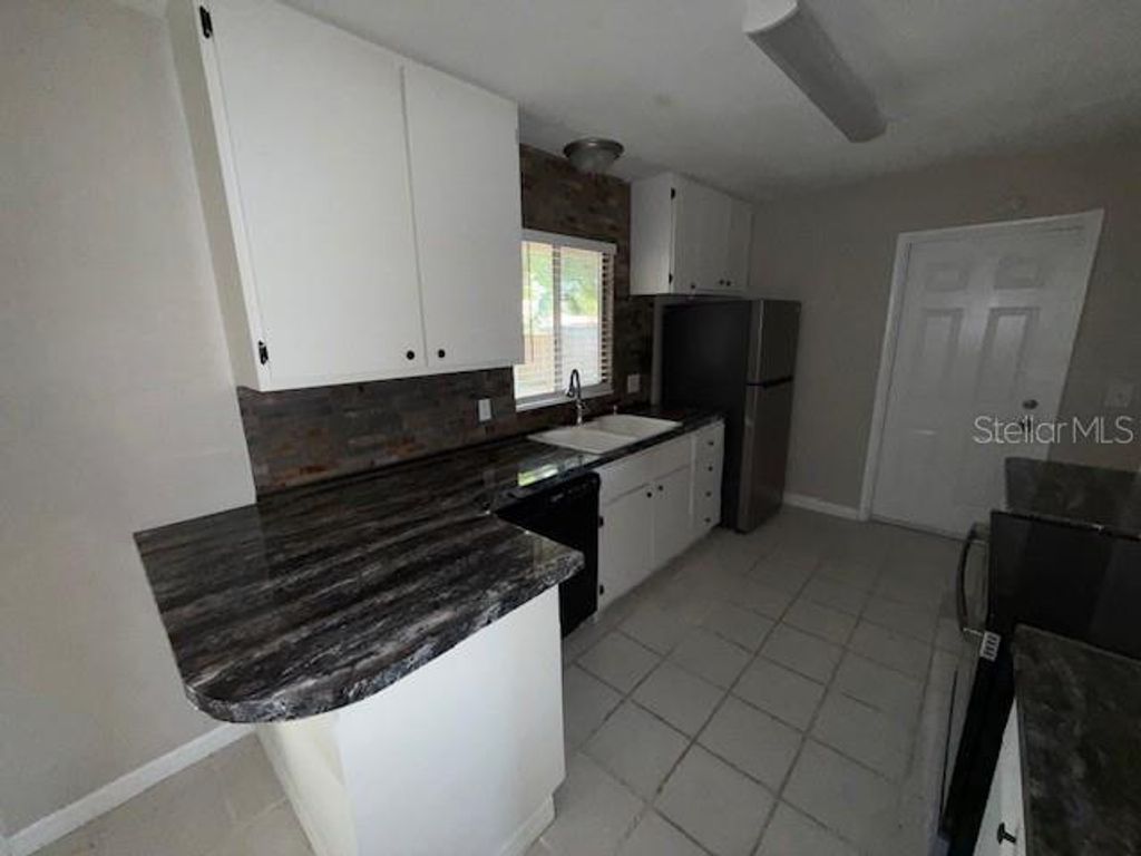 Photo of 1334 Stately Oaks Drive NW, Winter Haven, FL 33881 (MLS # S5147546)