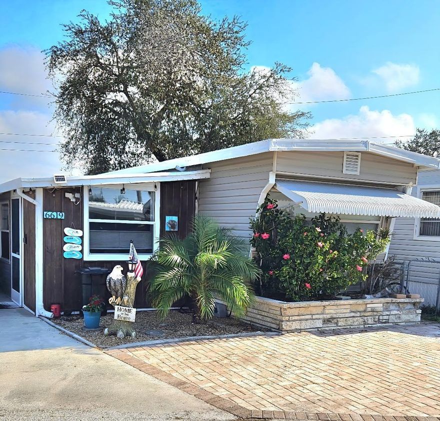 Step inside a world of nostalgic living with the timeless appeal of rustic farmhouse charm. This two Bedroom, two Bath vintage Mobile Home is situated on a pet-friendly street in the highly desired, active 55+ Trailer Estates community. Fresh coastal colors and a distressed wood accent wall add character to cozy living and dining rooms. The kitchen features a vintage-inspired island prep table with hanging pot rack that is practical with a stylish country feel. Motion-detected under cabinet lighting. Both Primary and Guest Bedrooms have ensuite Baths. Inside laundry space. A rear tropical patio deck creates an intimate outdoor oasis. Plenty of shed storage space. You own the land. No lot rent, Park Fees are included into annual real estate taxes. Boaters have direct access to Sarasota Bay from the Marina. Trailer Estates community offers so many options for a great day! Enjoy the large, heated community pool, hot tub, gym and wood shop. The community buzzes with pickleball, shuffleboard, kayaking, horseshoes, bocce, dancing and more. A US Post Office on site. 10 minutes to the SRQ Airport. Convenient to shopping, restaurants, the Arts and everything in Bradenton/Sarasota. Bring offers!