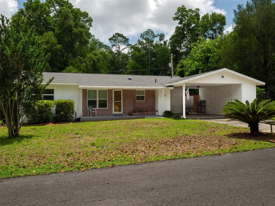 Move-in ready, Mid-Century charmer walking distance to UF with too many updates to list. The first thing you notice as you enter the home are the refinished original wood floors that look brand new. The fully renovated kitchen is stunning with new appliances, quartz countertops, a disposal and a laundry closet bringing the outdoor laundry inside the house. There is a split-bedroom floorplan which is very rare for homes of this era offering separation and privacy. There are two period bathrooms including a pink bathroom inspired by Mamie Eisenhower declaring pink as her favorite color. This caused builders nationwide to install pink bathrooms as a tribute to her during the 1950's. The Family Room overlooks the generous backyard and lets in an abundance of light. A two-car carport with loads of storage completes this lovely home. Updated electrical, updated plumbing going in and out, a new water heater, Pella double-paned windows, a transferable termite contract and a 2021 roof mean you'll have worry-free living for years. Close to shopping, restaurants, parks and all Gator sporting/cultural events.
