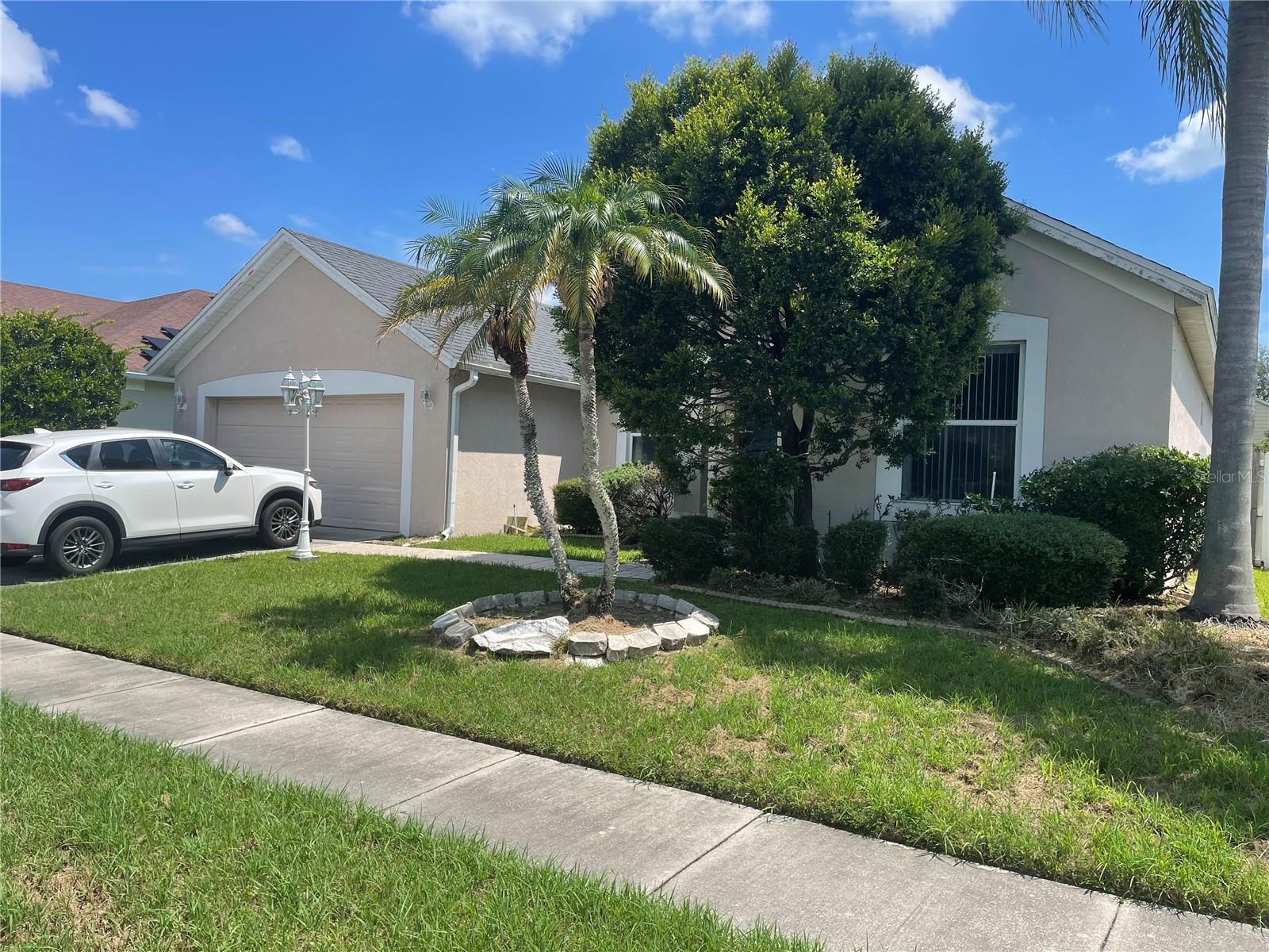 Great potential in this Hunters Creek pool home — priced to sell! This spacious home features a desirable three-way split floor plan with a formal dining room and an inviting great room. You're welcomed by soaring ceilings, a separate family room, and an open eat-in kitchen complete with a breakfast nook, bar seating, and an interior laundry room. The 2/1/1 bedroom split includes a versatile fourth bedroom that can easily serve as a home office or den, enhanced by elegant double French doors. The master bedroom, living areas, and kitchen all offer beautiful views of the sparkling pool and oversized backyard. The master suite is generously sized and features a luxurious bath with double vanities, a garden tub, a separate shower, and a walk-in closet. Step outside to a fully screened-in pool with an expansive covered patio area—perfect for relaxing or entertaining. The fenced backyard offers privacy and plenty of space for outdoor enjoyment. This home boasts easy-to-maintain flooring throughout—laminate and tile, with no carpet anywhere.
