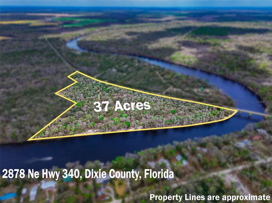 An extraordinary opportunity to own nearly half a mile of pristine Suwannee River frontage across approximately 36.9 acres in North Florida. This remarkable riverfront property offers approximately 2,017 feet of frontage, nearly 1/2 mile, along one of the most beautiful and unspoiled stretches of the Suwannee River, complete with a natural sandy beach and breathtaking views of the surrounding landscape.

Formerly, Bob’s River Place, family owned and operated for over 40 years, drew in hundreds of thousands of customers nationally and internationally and was featured as one of the top "Hidden Gems In Florida."

Set high above the river, the property features a 2,610-square-foot elevated lodge-style, 3 bedroom 4 bath home designed to capture the beauty of its natural surroundings. The residence showcases soaring vaulted wood ceilings, expansive windows framing panoramic river views, and a dramatic stone fireplace that serves as the centerpiece of the main living area. 

Inspired by mid-century modern design elements and natural materials, the home blends seamlessly into the landscape and offers a peaceful treehouse-like setting overlooking the river. A spacious wraparound porch provides the perfect place to relax and take in the tranquil scenery.

The property also includes a Florida Department of Environmental Protection Sovereign Submerged Land Lease covering approximately 22,609 square feet of the Suwannee River designated for a commercial swimming area, historically used for river recreation associated with the property.

Additional structures and improvements remain throughout the property including pavilions, gathering areas, and recreational spaces. These areas previously supported outdoor gatherings and events while preserving the natural character of the land.

Utilities include electric service, well water, septic systems, underground plumbing throughout portions of the property, and fiber optic internet availability. The landscape offers a beautiful mix of mature trees, open spaces, and scenic river views with both sun and shade throughout the property.

Located in the heart of Florida’s renowned spring region, the property is within close proximity to Ginnie Springs, Gilchrist Blue Springs, Poe Springs, and Rock Bluff Springs. Everyday conveniences including grocery stores, medical offices, restaurants, and banks are approximately ten minutes away, while Gainesville and Lake City are both within about forty-five minutes.

This unique riverfront property offers exceptional privacy, natural beauty, and a rare opportunity to own a significant stretch of Suwannee River frontage.