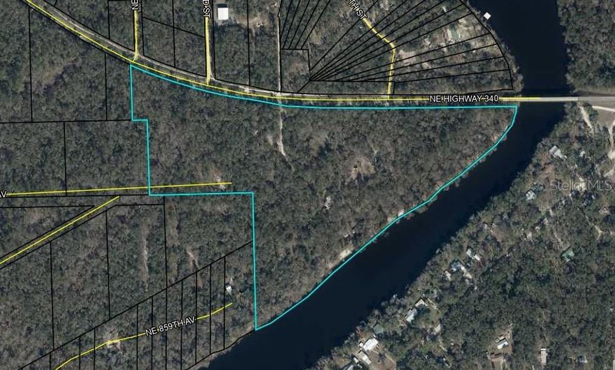 A rare opportunity to own nearly half a mile of pristine Suwannee River frontage across approximately 36.9 acres in North Florida. Formerly known as the iconic Bob’s River Place, this one-of-a-kind property has been recognized as one of Florida’s hidden gems and has a decades-long history as a destination for outdoor recreation and riverfront gatherings.

The property features approximately 2,017 feet, over a half mile, of river frontage with a natural beach area along one of the most beautiful and clean stretches of the Suwannee River. For years, visitors traveled from across the state to experience the unique setting and water activities offered here.

The site includes a 2,444-square-foot elevated cabin-style home with panoramic river views, vaulted ceilings, a large fireplace, and expansive windows that capture the surrounding natural landscape. With its wraparound porch and elevated design, the home offers a peaceful treehouse-style setting overlooking the river and could serve as a private residence, lodge, amenity center, or gift shop.

Multiple structures and improvements remain across the property including pavilions, gathering areas, restroom facilities, a pole barn, stage area, and recreational spaces that previously supported concerts, weddings, retreats, and seasonal events. Two local boat ramps provide convenient river access, including one across the river and another nearby across the road.

Although currently zoned residential, the property has historically operated as a successful recreational park and offers exceptional potential for redevelopment as an event venue, campground, outdoor recreation destination, or private riverfront retreat. County guidance has previously indicated the potential for up to approximately 100 RV sites with the appropriate approvals. 

Utilities include electric service, well water, septic systems, fiber optic internet availability, and underground plumbing throughout the property. The landscape offers a beautiful mix of sun and shade with mature trees, open gathering areas, and scenic river views.

Located in the heart of Florida’s world-famous spring region, the property sits near Ginnie Springs, Gilchrist Blue Springs, Poe Springs, and Rock Bluff Springs. Everyday conveniences including medical offices, grocery stores, banks, and restaurants are within about 10 minutes, while Gainesville and Lake City are both within approximately 45 minutes.

This extraordinary riverfront property combines privacy, natural beauty, history, and redevelopment potential along one of Florida’s most treasured waterways.  

More information, photos and videos coming soon.