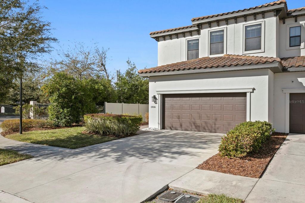 Photo of 13016 Sanctuary Village Lane, Tampa, FL 33624 (MLS # TB8480100)