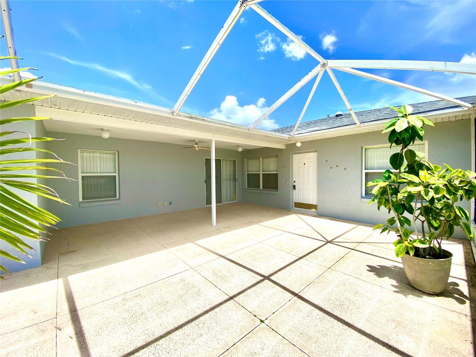 One or more photo(s) has been virtually staged. Motivated Seller - This home qualifies for a NO MONEY DOWN LOAN and Seller is willing to assist with your standard closing costs!! Call today This 2 bedroom, 2 bath VILLA located in a GATED COMMUNITY has a huge covered and screened patio for relaxing and is tiled through-out for easy care maintenance. ALL APPLIANCES are INCLUDED!! Washer, dryer, side by side refrigerator, dishwasher, microwave... Community POOL and Clubhouse is one street over. Community maintains and mows the grounds for stress free living. Don't miss out on this opportunity! Utilities are on for inspection so call to schedule a time to see today.