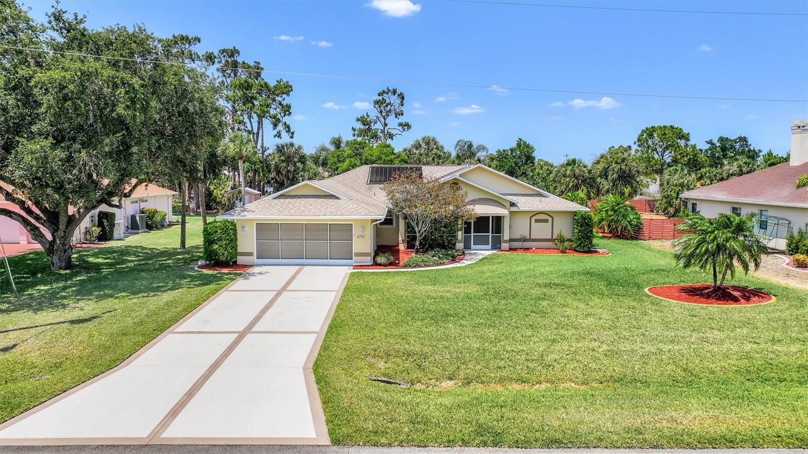 One or more photo(s) has been virtually staged. Assumable Flood Policy!!!! Get ready to fall in love with your dream home! Presenting an exceptional opportunity to own a well-maintained residence in the highly sought-after, deed-restricted community of Terrapin Wood. This move-in ready 3 bed, 2 bath, 2-car garage pool paradise in the exclusive, rarely available Terrapin Wood community is calling your name! Nestled on nearly half an acre of pure bliss, this vibrant home offers a rare combination of privacy, space, and natural beauty and backs up to a serene turtle preserve, blending country charm with modern convenience in the rapidly developing buzzing Bayshore area. The property has not experienced flooding in recent hurricanes and includes an assumable flood insurance policy, roll-down hurricane shutters, and almost 2,000 sq ft of bright, airy living space. Picture yourself soaking up the sun on the oversized lanai or splashing in the screened Mansard-caged pool, surrounded by lush landscaping and ultimate privacy with no rear neighbors. Inside, you’ll find a cheerful split floor plan, soaring ceilings, sleek tile and wood laminate floors, and three sliding doors (two pocketing!) that flood the home with natural light. Multiple living areas, including separate formal and family rooms, provide flexibility for both daily living and entertaining. The updated kitchen is a showstopper with sparkling quartz countertops, a pantry, a cozy eat-in nook, and a formal dining area perfect for hosting. Work-from-home? No problem! Bedroom 2 rocks a Murphy bed with built-ins, while bedroom 3 doubles as a stylish office with custom cabinetry. Every detail shines, from the front screened entry with a wood ceiling to the epoxy-floored garage with a screen door, freshly painted driveway, and Manabloc plumbing. With too many upgrades to count (check the attached list!), this home has been lovingly maintained and is bursting with pride of ownership. The landscaped grounds are serviced by a private well irrigation system, and a 10x16 storage shed offers ample space for equipment or recreational items. Located in a prime spot on a quiet cul-de-sac street just minutes from downtown, I-75, schools, dining, shopping, and boating. Plus, you’re perfectly positioned between RSW and Punta Gorda airports (under 30 minutes away) enhancing convenience for travel. Terrapin Wood is a close-knit community of just 54 homes. All property owners are members of the Property Owners Association, with governing documents and community information accessible on their website. This home exemplifies Florida living at its finest. Private showings are available by appointment. Come see this stunner for yourself—you won’t want to leave!
