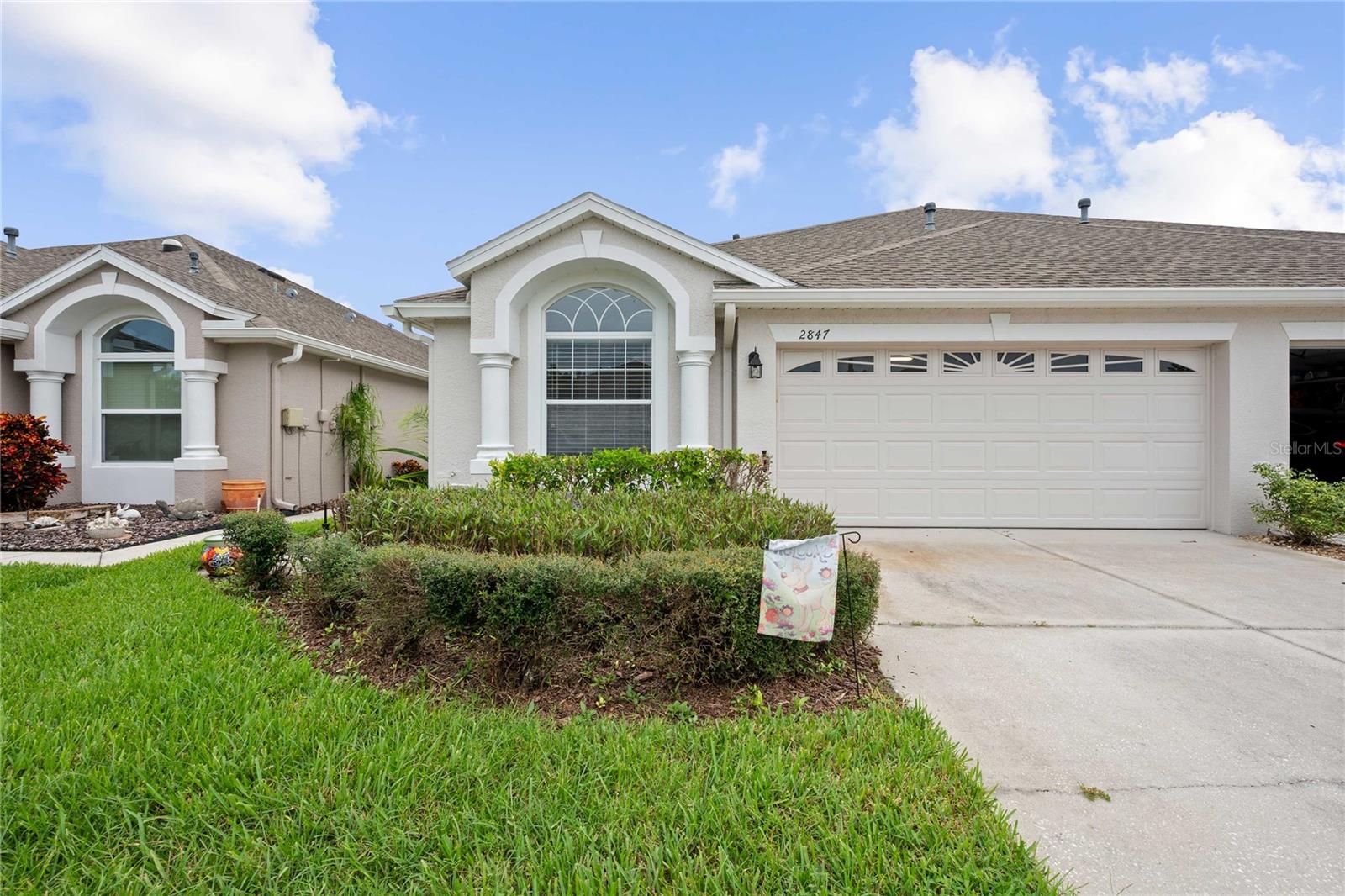 Welcome to the much sought-after Tanglewylde Villas in the Oakstead subdivision, where peaceful pond and conservation views create a serene backdrop. This Charleston model, by Tripp Trademark offers 2 bedrooms, 2 baths, plus a versatile OFFICE, and a 2-car garage, all thoughtfully arranged in a split-bedroom floorplan. The spacious great room showcases scenic wildlife and tranquil water views, while the kitchen features Corian countertops, oak cabinetry, a wide closet pantry, and room for a cozy eat-in space. All kitchen appliances convey—including a gas range—making it move-in ready. The guest bedroom and full bath are located at the front of the home, complete with a walk-in closet, while the primary suite is privately tucked in the rear, offering stunning sunset views, a walk-in closet, and an ensuite bath with a linen closet. Step out onto the covered and screened rear patio for peaceful evening relaxation surrounded by nature overlooking the back fenced yard and pond. NEW AC and HOT WATER HEATER were installed in 2021.The roof was replaced in 2019, and exterior painting was completed in 2021. Low-maintenance living is made easy with HOA fees of just $205/month, which include roof, exterior paint, lawn care, and sprinkler system.
Oakstead’s gated community offers resort-style amenities including a clubhouse, fitness center, two pools, tennis courts, volleyball, playgrounds, and a park. This home presents both comfort and value- Whether you're downsizing, relocating, or simply seeking a peaceful retreat, 2847 Torrance Drive is a place to relax, recharge, and feel at home.