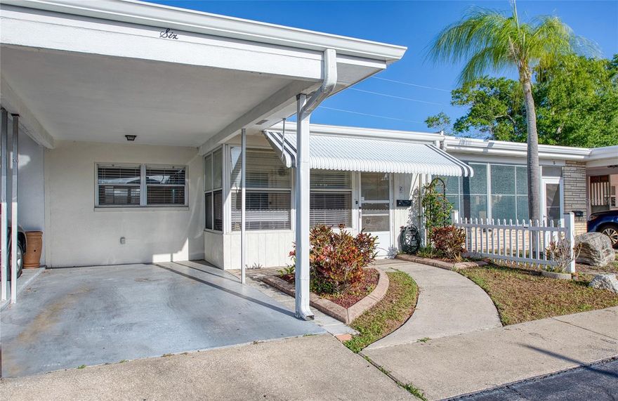The Villa is a rare find offering one of the most affordable properties in Pinellas County living this close to the Gulf beaches (1.5 miles). This inviting 832 sq ft, 2-bedroom, 1-bath Villa (built 1970) sits in a well-maintained 55+ community and delivers exceptional value with low monthly HOA fees of just $170 (covers water, sewer & trash, grounds maintenance, clubhouse and pool maintenance).  Step into the covered screened front porch featuring a ceiling fan and convenient storage closet – the perfect spot for relaxing mornings or evening breezes. Inside, enjoy an open floor plan where the living room, dining area, and kitchen flow seamlessly together, creating a spacious feel ideal for everyday living and entertaining.  The two bedrooms offer comfortable retreats, while the full bath provides practical convenience. A standout feature is the direct access to the rear outdoor space – highly desired for privacy & gardening.  Community highlights include a refreshing pool, clubhouse, shuffleboard, and low-maintenance living. The location shines as truly walkable to every daily need: shopping, dining, banking, Publix, and more are just steps away. It's in a non-evacuation zone and non-flood zone, offering peace of mind during storm season.  Best of all, you're approximately 1.5 miles (a quick drive or enjoyable bike ride) from the sugar-sand shores of Indian Rocks Beach and the Gulf of America – unbeatable proximity at this price point.
Whether you're seeking a primary residence, winter retreat, or solid investment, this home checks every box for affordable, low-maintenance Florida living near the water.  Don't miss this opportunity in one of Largo's hidden gem communities!