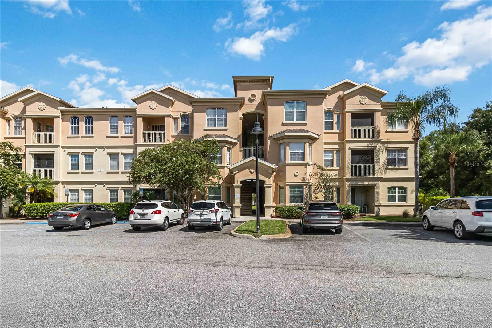 Tucked inside the quiet charm of the gated community of Terrace Ridge, this beautifully designed condo offers a peaceful retreat in the heart of Central Florida. Whether you're looking for a primary residence, a vacation getaway, or a smart short- or long-term rental investment, this home is ready to fit your lifestyle with grace and ease.
Step inside and you’ll immediately feel the warmth of the open, split floor plan. With two generously sized bedrooms, each with rich bamboo flooring and private en-suite bathrooms, this layout is ideal for comfort and privacy. The primary suite is a true retreat with double vanities, a soaking tub, and a separate walk-in shower — perfect for unwinding after a long day.
The kitchen is both spacious and functional, with ample counter space, plenty of cabinetry, and a breakfast bar that opens up to a light-filled great room with soaring dimensions (14 x 19 ft!). Whether you're entertaining friends or enjoying a quiet evening in, the open layout makes gathering feel effortless. A built-in desk nook is ready for work-from-home days, while the dining area flows beautifully to your private balcony — just the place to enjoy your morning coffee or a glass of wine as the sun sets.
Practical features like full-sized washer and dryer tucked in their own laundry room and elevators throughout the building add to the ease of everyday living. And the low condo dues (some of the lowest around!) include cable TV, internet, water, and sewer — so you can focus more on living and less on bills.
Terrace Ridge isn’t just a place to live — it’s a lifestyle. Enjoy resort-style amenities including a large pool, hot tub, clubhouse, game room, and a fitness center. You’re also just minutes from I-4, Highway 27, 192, and all the shopping, dining, golf, and world-famous attractions that Central Florida has to offer. Lakeland and Orlando are both within easy reach, making this an ideal central location.