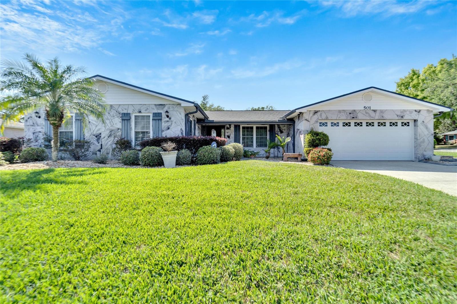 NO HOA NO CDD.Are you looking for a BEAUTIFUL home, that has been well maintained, great curb appeal, with a POOL, in a Great Location? Come view this Huge 4 bedroom/3 bath, 2 car garage. This home sits on an oversized corner lot which has a fairly new roof and AC. The upgraded kitchen offers white cabinets with beautiful granite countertops with newer appliances. As you walk into the home there is a foyer with a separate dining room, living room and large family room. The oversized living has lots of space with a stone designed fireplace to enjoy. You will love the idea of walking into a massive master bedroom that has beautiful French doors and huge walk in closet. The master bath has a separate shower with dual sinks. The three additional rooms are located on a separate side of the home. You can easily make this home into a 5-bedroom. One of the best features of this home is the massive enclosed screened pool. You get to come home after a long day of work and enjoy the beautiful scenery on the huge lanai with an outside shed for all your tools. This home is one of a kind and truly has so much to offer.