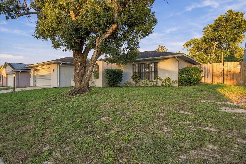 Photo of 8731 Woodcrest Drive, Port Richey, FL 34668 (MLS # TB8561309)