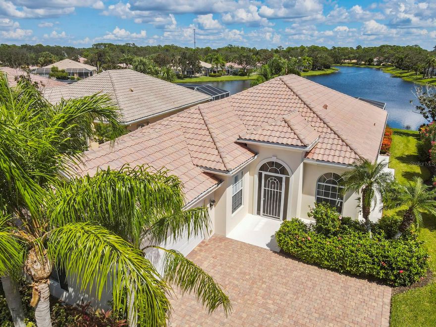 Don’t miss out on this beautiful 3-bedroom/3-bathroom plus den home in the wonderful community of Village Walk. The home has an abundance of natural light and a large open floor plan making it the perfect place to entertain family/friends. The living room is bright and spacious with sliders out to the lanai. The light and airy kitchen is open to the living and dining areas and features a window looking out to the backyard, white cabinets, and a breakfast bar. Tile is featured in the main living areas for easy maintenance. The master bedroom is extremely roomy and features sliding doors out to the beautiful backyard, three closets, and a dual ensuite bathroom with multiple vanities, and a separate tub and double entry shower. The other two bedrooms share an adjacent bathroom. There is an indoor laundry room with lots of cabinet space for added convenience. The two-car garage allows for plenty of additional storage. Relax and enjoy dinner or a morning cup of tea on the fully screened lanai that has expansive water view. Take advantage of the countless amenities that Village Walk has to offer. Go for a swim in one of the multiple sparkling swimming pools or get a workout in at the state-of-the-art fitness center. Grab a partner and play a game of tennis on one of the many Har-Tru courts. Avoid traffic and fill up your car at the community gas station or drop a letter off at the community post office.  Pick up a coffee at the Village Walk Cafe and enjoy the Florida sunshine during a walk on one of the various trails while taking in the views of nature. Enjoy many events at the community clubhouse or take some quiet time and read a book in the library. In addition to all of this, you are close to the Legacy Trail, shopping, restaurants, medical and Gulf beaches.