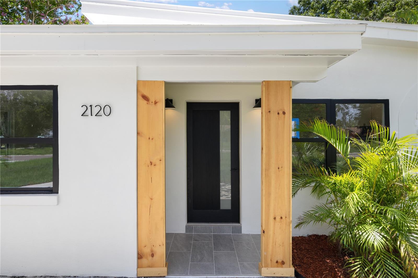 This fully renovated home blends modern comfort with mid-century charm in the desirable Lakewood Estates neighborhood of St. Petersburg. As you step inside, you’ll be welcomed by bright, open-concept living with a spacious living and dining area filled with natural light, highlighted by sliding glass doors that lead to a spacious backyard—ideal for entertaining or enjoying a peaceful morning outdoors.
The split-bedroom layout offers great separation of space. Two bedrooms and a full bath are located on one side of the home, while the primary suite is set privately on the opposite side. The fourth bedroom, located just off the kitchen, adds flexibility—perfect for a guest room, home office, or playroom.
The primary suite overlooks the backyard and features a beautifully updated en-suite bathroom with a glass-enclosed walk-in shower, modern vanity, and a spacious closet. A private door leads directly from the bedroom to the backyard—perfect for stepping out with your morning coffee. The kitchen has been completely renovated, featuring solid surface countertops, brand-new stainless steel appliances, soft-close shaker cabinetry, and a clean tile backsplash. A wide window above the sink adds natural light and a view to the outdoors. Just off the dining area, a custom built-in nook offers the perfect spot for a coffee bar or wine station, blending style and convenience.
Both bathrooms have been fully updated with quality finishes and new plumbing. The home also includes a separate laundry room with additional pantry storage, making everyday living a breeze.
Updates completed in 2025 include a brand-new roof, new AC system, upgraded electrical panel, new plumbing, and a new irrigation system—giving you peace of mind with all major systems already taken care of.
Also, this home is located in flood zone X, flood insurance is not required. Tucked away on a quiet street and just minutes from downtown St. Pete, beaches, parks, and golf, this move-in-ready home offers timeless charm, smart design, and modern upgrades throughout. Be sure to view the 3D tour attached to the listing and schedule your showing today.