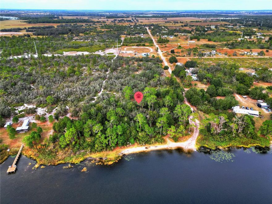 Discover the perfect blend of privacy, adventure, and opportunity with three adjoining parcels being sold together WITH NO HOA in the Lake Wales Estates neighborhood. Two of the parcels (1.24 acres and 1.25 acres) are buildable, giving you flexible options for placing a home, manufactured home, or weekend retreat. The third parcel (3.94 acres on county records) provides beautiful lake frontage on Lake Lizzie, with portions submerged, offering peaceful water views.  Lake Lizzie is a private-access lake available exclusively to residents of Lake Wales Estates and residents that live across on the lake off of Lake Buffum, adding to the tranquility, privacy, and recreational enjoyment of the area. This rural community is known for its dirt roads, wide-open land, making it ideal for side-by-sides, four-wheelers, farm animals, and anyone seeking true space and freedom. Whether you're building a homestead or looking for a long-term investment, this is a rare opportunity to own multiple connected parcels in a quiet and growing part of Polk County — secluded yet still close enough for an easy drive into town.