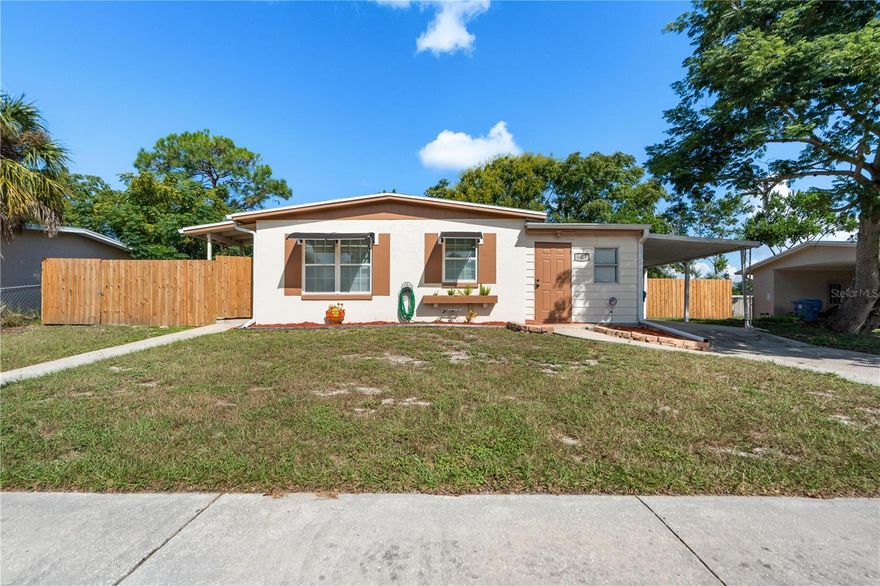 This charming 2 bedroom, 1 bathroom home is move in ready.  Upon entering the front door you wil be greeted with an open concept layout,the kitchen wood cabinetery with a dining area. The second bedroom has a private front entrance adjacent to the carport. The back yard is fully fenced.  The storage area includes washer/dryer hook ups with access from the back yard.  New roof 2025 HVAC 4 to 5 years old.  Home is close to shopping, hospitals and airports. Schedule your private showing today.