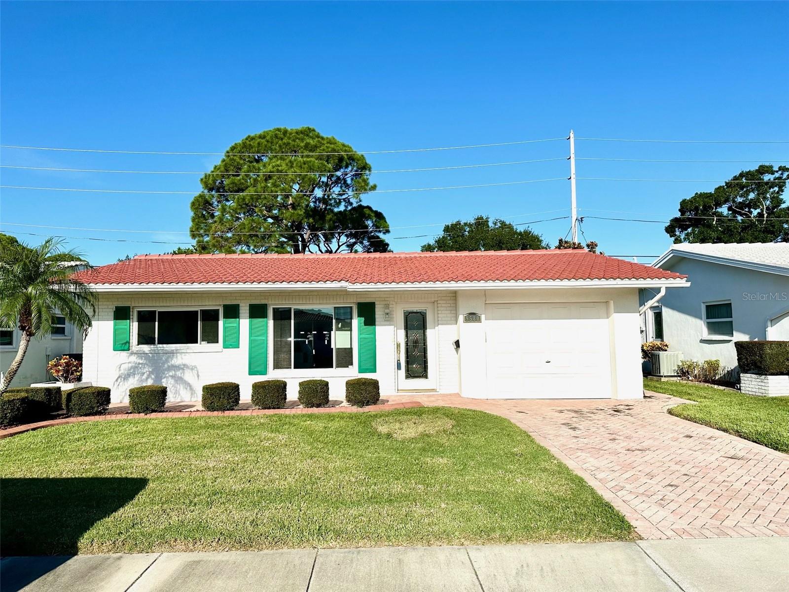 Wow!! Amazing home which has been remodeled beautifully in the Mainlands, a 55+ community. Welcome to your new home in this sought after 55+ community! This beautiful, over 1200 square foot residence, features two spacious bedrooms and two full baths, perfect for comfortable living and entertaining. A bright and airy living room welcomes you, offering a perfect space for relaxation or gatherings with family and friends. The well appointed kitchen includes ample counter space and storage, making it a cooks delight. The new stainless appliances are a bonus. Enjoy the additional bonus room, which can be used as a home office, den or hobby area adding versatility to your living space. The view from the windows in the bonus room allows views of Freedom Lake. The Master bedroom is large and features an on-suite bathroom for convenience and privacy. Step outside and see the lovely front patio and back stepping stone patio. This home is perfect for those looking to downsize without compromising comfort and convenience. Some major upgrades include a NEW ROOF -2025, New Hot Water heater -2025, New Dishwasher - 2025, Crown Molding, Ceramic tile throughout, updated bathrooms, Stone countertops, and new laminate flooring in the bedrooms. This is a must see! The amazing upgrades make this home a fantastic option.