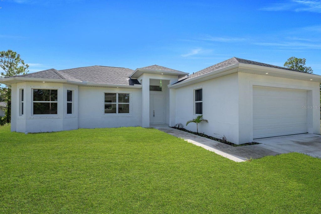 Photo of 523 Harry Thayer Avenue S, Lehigh Acres, FL 33974 (MLS # A4704639)