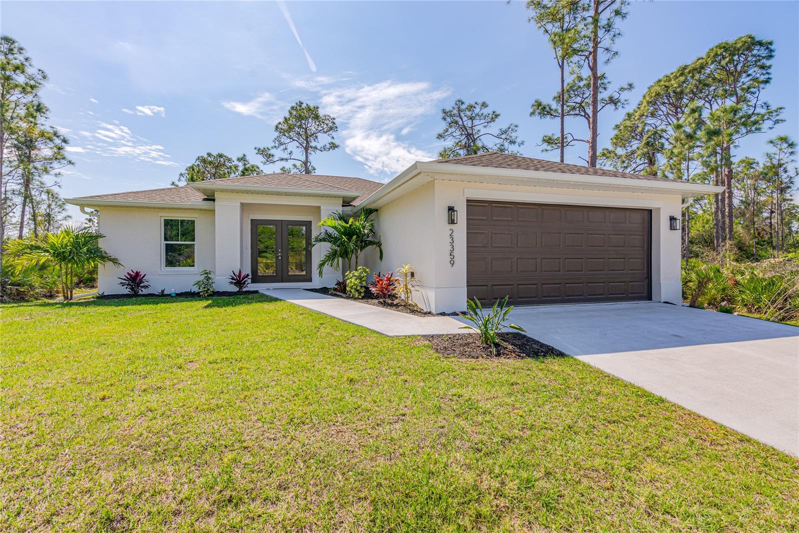 Recently Completed. Photos are a completed Banyan Model with very similar specifications. Very Private Corner Lot with no home along side or behind. This beautifully appointed home features 1556 sq feet of living area with four bedrooms and two full bathrooms. Kitchen features granite counters with a four inch backsplash, stainless appliances and shaker style cabinets. Home features wide colonial style baseboards and luxurious laminate throughout, exterior features include hurricane impact windows, concrete driveway, bahia sod and a front yard landscape package. Great starter home for the young family or ideal for a retiring family.