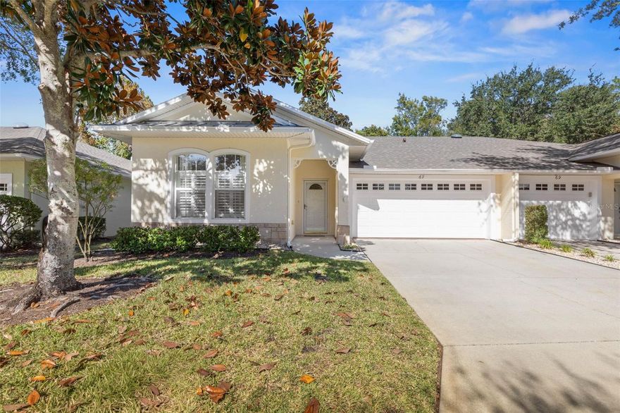 Welcome to Arbor Trace Villas, one of Palm Coast’s best-kept secrets.

This beautifully updated 3 bedroom, 2 bath, single-story block construction townhome offers approximately 1,454 square feet of comfortable living space plus a 2-car private garage. Offering Luxury plank flooring and neutral décor, it feels clean, modern, and truly move-in ready.

Step inside to an open floor plan with vaulted ceilings, recessed lighting, charming archways, and built-in niches and shelving that add character. The spacious kitchen features abundant cabinet storage, ample counter space, a double pantry, under-cabinet lighting, a beautiful backsplash, Whirlpool stainless steel appliances, a newer sink, and updated fixtures.

The primary suite includes a generous walk-in closet and an en-suite bath with a step-in shower. Both bathrooms have their own linen closets. A full laundry room with a utility sink adds everyday convenience.

Enjoy the light-filled sunroom overlooking green space with a private garden walkout, perfect for morning coffee or quiet relaxation. Additional highlights include transom windows, plantation shutters and blinds throughout, wonderful natural light, and large closets. The two-car garage offers an extra refrigerator, workbench, and shelving. Major updates include a new water heater in 2022, A/C unit in 2021, new roof in 2023, and fresh, exterior paint in 2024.

The monthly fee includes exterior building maintenance, roof, lawn care, pest control, community lighting, clubhouse, and heated pool, providing low-maintenance living. All of this is located just minutes from the beach and in the heart of town, close to Island Walk shopping with Publix, dining, retail, entertainment, medical offices, community centers, and parks. It is also a short drive to Historic St. Augustine, Daytona Beach, and Daytona Beach International Airport.

This Arbor Trace villa offers a wonderful blend of comfort, convenience, and location.