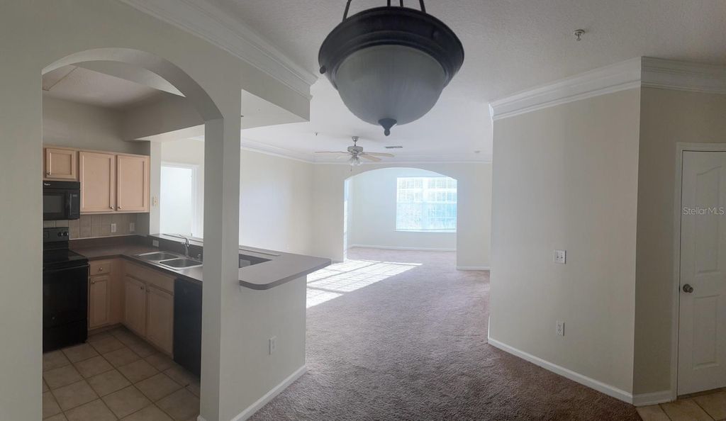 Photo of 12861 Madison Pointe Circle #207, Orlando, FL 32821 (MLS # O6375857)