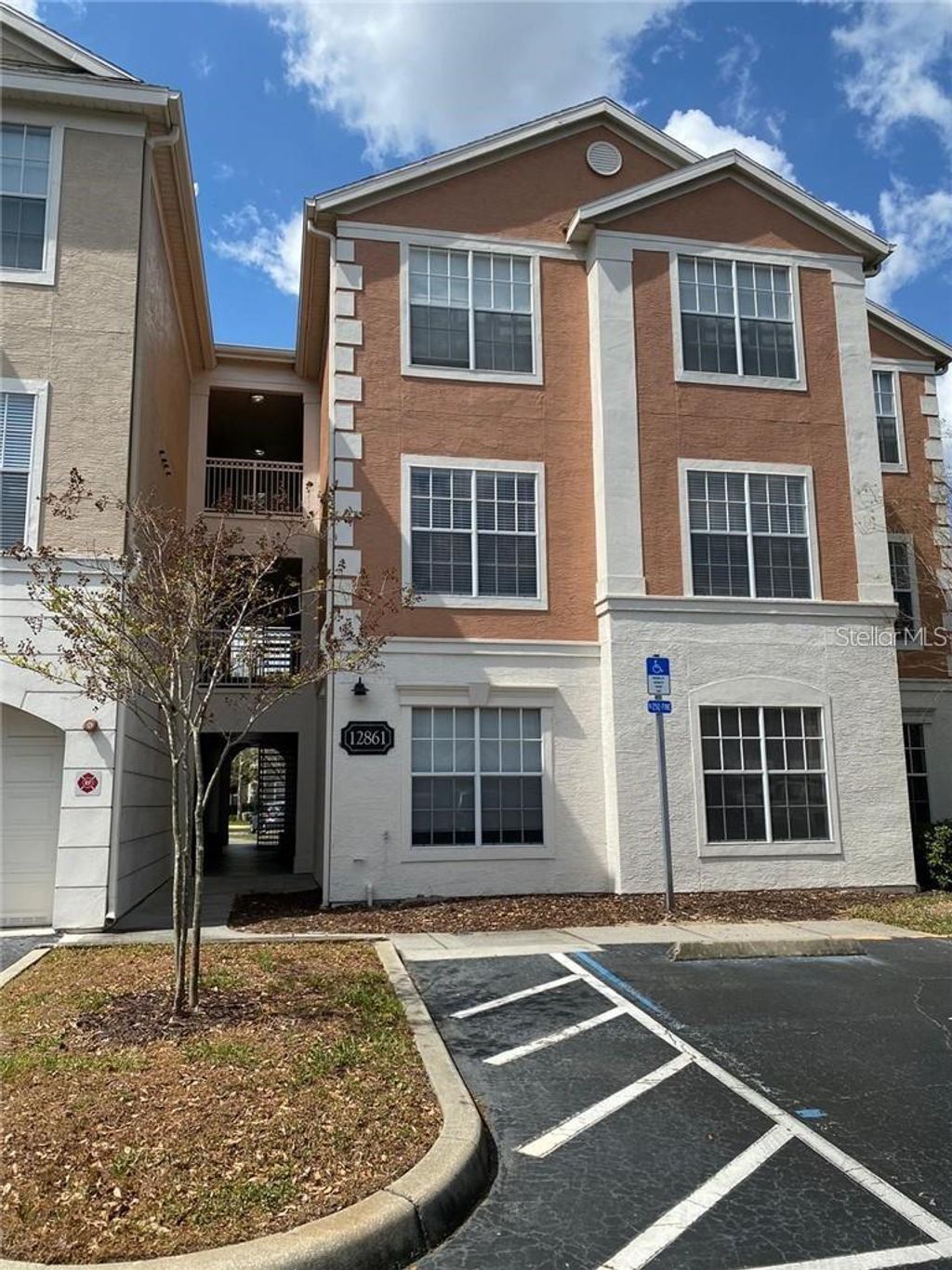 Photo of 12861 Madison Pointe Circle #207, Orlando, FL 32821 (MLS # O6375857)