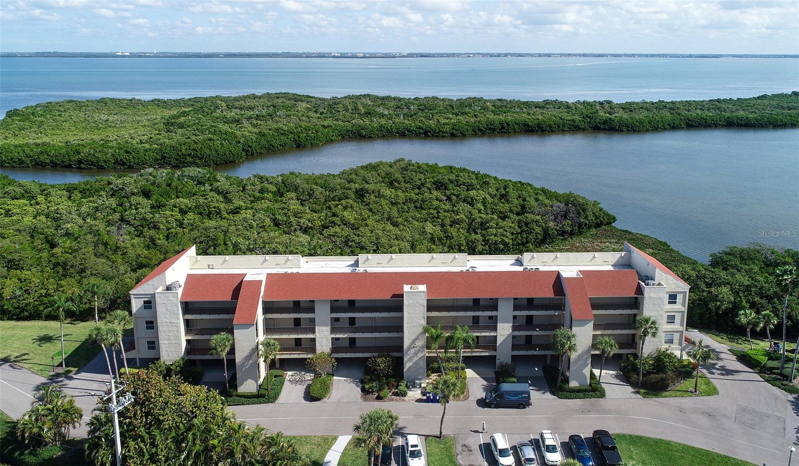 OPEN FOR SEASON 2026. Also available off season @$3300 per month. Rarely available tranquil 2 bed/2 bath corner unit condo with full bay views at desirable Windward Bay! This light and bright condo is the perfect place to spend your season in the sun in a quiet community directly across the street from the sparkling Gulf of Mexico waters and white sandy beaches of Longboat Key. Walk or bike along the winding estuary trails along the bay! Bring your kayak and launch from the community dock! Windward Bay is perfect for those seeking an active lifestyle. Amenities include two marinas, kayak storage, walking and bike trails, two tennis courts, fitness center, two heated pools, saunas, and direct Bay access. Centrally located to the beach access, restaurants, shops of St. Armand’s Circle and downtown Sarasota. Just a short ride over the bridge in the other direction to explore Anna Maria Island. Extremely quiet and comfortable condo. Your small dog is welcome!
