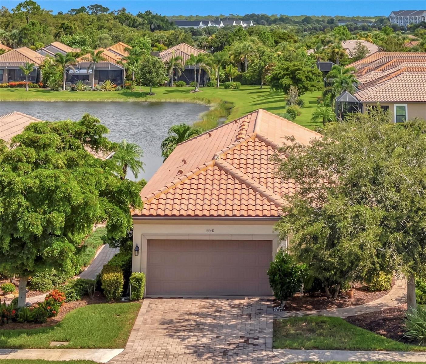 Discover the perfect blend of luxury, comfort, and Florida charm in this beautifully maintained 3 bedroom, 2 bathroom, plus den, home located in the sought-after, gated community of Bellacina. With exquisite curb appeal, high-end interior finishes, and thoughtfully designed spaces, this home offers everything you need to live your best life on the Gulf Coast.
Step inside to an open-concept layout featuring high ceilings, abundant natural light, and elegant flooring throughout. The spacious living room flows seamlessly into a gourmet kitchen, complete with granite countertops, stainless steel appliances, a gas cooktop, custom cabinetry, and a large island perfect for entertainment. Perfectly situated adjacent to the kitchen is your formal dining room.
The primary suite is a peaceful retreat offering a generously sized bedroom, walk-in closet, and a spa-like en-suite bathroom with dual vanities and a glass-enclosed shower. Additional bedrooms and baths provide comfort for guests or family, and a flex space offers room for a home office, den, or hobby room.
Step outside to enjoy your private lanai and tranquil backyard – ideal for al fresco dining or simply unwinding in the Florida sunshine. The professionally landscaped yard provides a lush backdrop to your outdoor lifestyle.
This home also features a dedicated laundry room with storage cabinets and a two-car garage with ample storage.
As a resident of Bellacina, you’ll enjoy an impressive lineup of resort-style amenities designed for active, social, and relaxed living. The clubhouse serves as the community’s hub, hosting social events and activities. Stay healthy and active year-round in the state-of-the-art fitness center or cool off in the heated resort-style pool, complete with a heated spa and a spacious sundeck.
Additional amenities include pickleball and bocce ball courts, a dog park for your furry companions, and a cozy community fire pit for gathering with neighbors. Bellacina offers all of this with low HOA fees and no CDD, making it a rare find in the area.
Located just minutes from the pristine shores of Casey Key, vibrant downtown Venice, and the modern Sarasota Memorial Hospital – Venice campus, this home delivers unbeatable convenience with a laid-back coastal lifestyle.
Don’t miss this opportunity to own in one of Nokomis' most desirable neighborhoods. Schedule your private showing at 5548 Sentiero Dr today!