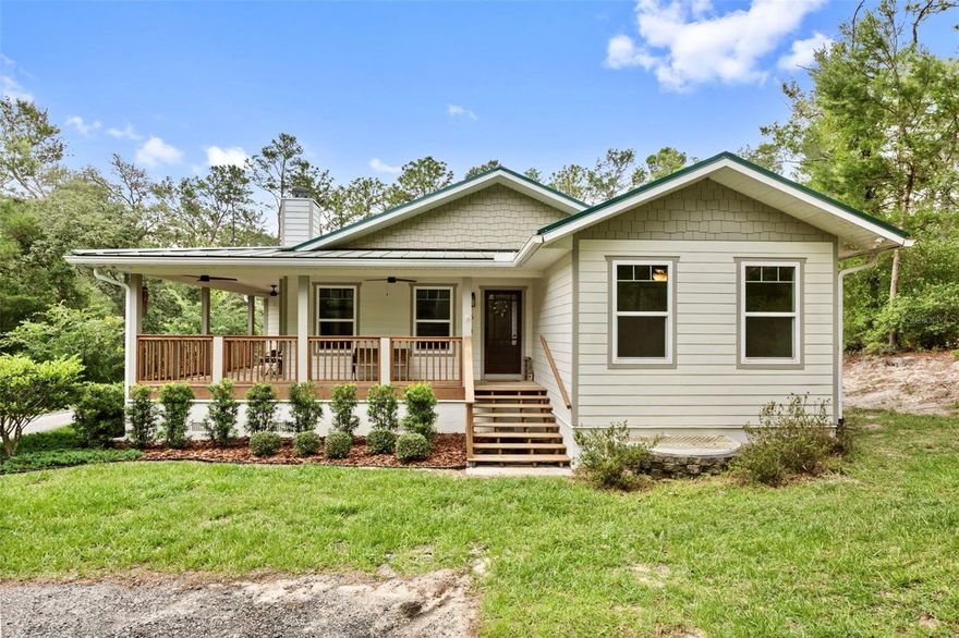 Welcome to your own private retreat in Volusia County! Nestled on 2.69 fully fenced acres with rural residential agricultural zoning and no HOA, this custom-built 2022 home with a detached workshop with electricity & water connection offers the perfect blend of privacy, functionality, and country living. Whether you're looking for space to spread out, room for your toys, or a property with true homestead appeal, this one checks every box. There is a dedicated RV parking space on the property with full 50-amp hookup and water connection. We can't forget about the chicken coop which includes 3 chickens, one being an Americana/Easter Egger known for mainly producing blue eggs adding to its charm & yes they come with the house! The single family block built home features 3-bedroom, 2-bathrooms offering 2,052 square feet of living space, a fireplace in the living room, with not a neighbor in sight providing flexibility & privacy. Get ready to fall in love with the oversized gourmet kitchen, filled with an abundance of natural light that makes the space feel warm and inviting. There is a spacious walk-in pantry offers the extra storage everyone dreams of even though the kitchen has extra cabinet's where everything will "have a place". & we can't forget about the gas stove! Just off the kitchen, you’ll find a built-in desk and office nook which is perfect for working from home or staying organized. The primary suite is designed with comfort in mind, featuring dual closets one being a spacious walk-in, as you continue to enter into the primary bathroom you will notice a relaxing soaking tub, a walk-in shower, and double vanities providing both functionality and plenty of space to unwind. The home also features a dedicated laundry room complete with a utility sink and built-in cabinetry, offering added convenience and extra storage space. The property is NOT in a flood zone! (Flood Zone X). The home features a massive 2-car attached garage with an oversized wraparound porch in the front along with an additional side porch- perfect for enjoying the outdoor space and nature with wild life sightings. The home is equipped with a durable metal roof with an estimated life span of 30-50 years for peace of mind when it comes to big ticket items! The spacious workshop is approximately 33x33 perfect for hobbies, storage, or business us which is being sold as-is. There is electricity & water being ran to it providing a versatile use of options. You will also enjoy a variety of established fruit plants including, fig, lemon, blackberry, guava & banana trees. The drain field was serviced and pumped out about a year ago for added peace of mind. The home has a hybrid tankless water heater and there is a 60-gallon propane tank as well. The home is also equipped with a water softener system, enhancing over all water quality. During construction, the owners went above and beyond by adding extra insulation throughout the home, enhancing energy efficiency and helping keep utility costs low year-round. This one of a kind home will not last. Schedule your tour today!