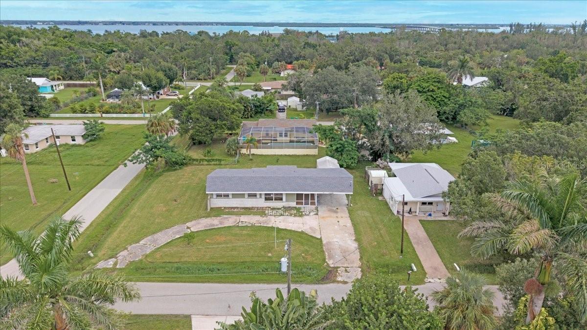 Charming Punta Gorda Retreat! Perfect as a starter home or a winter getaway, this cozy 2-bedroom, 1-bath residence offers 1,844 square feet of open living space, has been tastefully updated, and is move-in ready. Situated on an oversized corner lot, the property features a circular driveway, covered parking, and plenty of room to expand. Step inside to discover a bright and airy floor plan enhanced by recessed lighting, ceiling fans, and abundant natural light streaming through numerous windows. The spacious living room flows seamlessly into the updated kitchen and dining area, where you’ll find crisp white shaker cabinetry, granite countertops, and stainless-steel appliances. A cozy breakfast nook provides additional space that could serve as a home office, reading area, or hobby spot. French doors off the dining room open to the backyard, creating the perfect setting for indoor-outdoor living. Both bedrooms are spacious and feature built-in closets along with the new luxury vinyl flooring, and they share a full bathroom. Additional highlights include a 12x18 storage shed, a spacious covered carport with a dedicated laundry area, and a private patio for outdoor enjoyment. Recent updates add peace of mind with a new roof (2023), HVAC system (2025), new insulation on the exterior walls, and a beautifully updated shower. The oversized lot offers endless possibilities—whether you’re looking to expand, garden, or create your own outdoor retreat. Situated in the Bayview Terrace area of Punta Gorda with no HOA or deed restrictions, this home offers convenient access to historic downtown Punta Gorda, shopping, dining, US-41, and I-75. Nearby you’ll find public boat ramps, biking and walking trails, and so much more. Enjoy a short drive north to Boca Grande, Sarasota, and Venice, or head south to Fort Myers, Sanibel Island, and Naples. **PLEASE ENJOY THE 3D INTERACTIVE VIRTUAL TOUR ASSOCIATED WITH THIS LISTING**