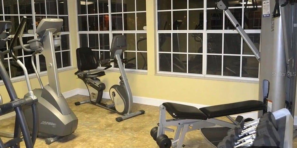 Photo of 2490 Sweetwater Club Circle #65, Kissimmee, FL 34746 (MLS # S5159065)