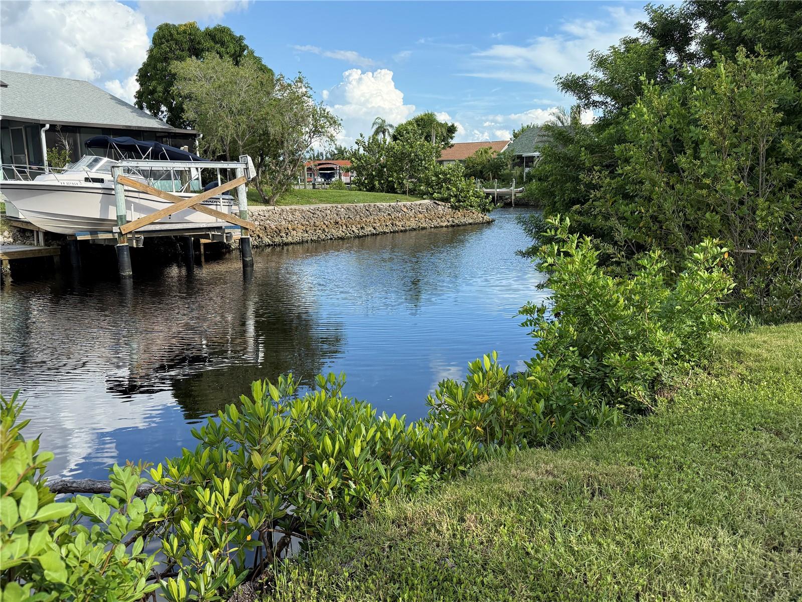 WATERFRONT LOT with 100 feet on a canal with NO bridges -access to Charlotte Harbor and on to the Gulf of Mexico. Located in Riviera Lagoons, this lot has been cleared, has 200 amp electrical service on the property and water meter on the property. Lot dimensions are 100x90. County approved building plans are available. Utilities are county water and septic. This lot is only minutes from historic downtown Punta Gorda shopping, dining, medical care, waterfront parks, walking and biking paths, fishing piers, art galleries, Charlotte Harbor Event Center, weekend farmer and artisan markets, weekend events and more.