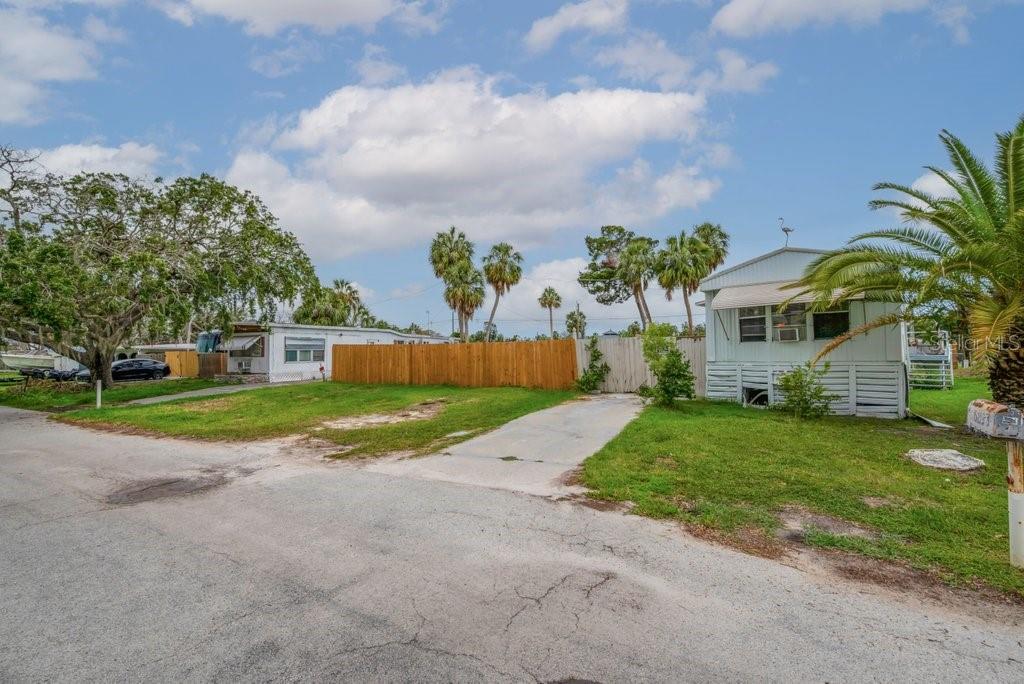 Welcome to this 2 bedroom 2 bath single wide manufactured home located in Edgewater Gardens. This home has a recent CLEAN 4 pt inspection. The area is seeing new construction all around and is close to restaurants and shopping with quick access to US19. Close proximity to Robert Rees Memorial Park and is perfect for those who enjoying boating or fishing. The home includes a second lot to be included in the sale as well (6829 Garden Dr). Two lots and a home all for under 100k! Structural engineer inspected the piers in April 2025. Insulation, vapor barrier and hurricane tie downs are new, permitted and inspected by city of New Port Richey in May 2025.