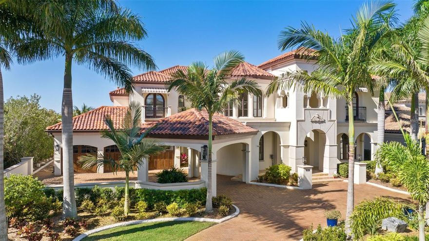 Designed to deliver exceptional waterfront living, enjoy spectacular water views and amazing sunsets from this stunning home. Privacy and elegance top the list of this spectacular Alvarez waterfront property located in the exclusive 24 hrs. gated community of Mirabay. This stunning pool home with a private dock and lift on a saltwater canal provides access to Tampa Bay, Apollo Beach, and South Shore waterside restaurants in just a few minutes. Discover the perfect blend of architectural genius, warmth, and sophistication. Offering Mizner-inspired architecture and attention to detail from the porte-cochere entry, European motor court and classic courtyard, to the graceful winding staircase and colonnade gallery with groin-vaulted ceilings. Refined elegance and outstanding craftsmanship greet you with Brazilian hardwood floors, 24-foot ceilings, sweeping water views and stunning outdoor living areas. Offering water views throughout the light-filled living spaces, with endless windows and gracious entertaining areas, the thoughtful design was specifically crafted for glamorous gatherings and the best of waterfront lifestyles in this resort community. The first level features spacious areas to entertain with a grand two-story foyer entry, living room, adjacent drawing room with wet bar that opens to the courtyard, formal dining room and gathering room. The chef’s kitchen boasts top-of-the-line appliances (Wolf & Sub-Zero), Cohiba granite countertops, center island and breakfast bar, butler’s pantry, wine refrigeration and a cozy breakfast area. A second level owner’s retreat provides a pleasant feeling to the lavish bath, private waterfront terrace, fireplace, morning bar and walk-in closet. Three additional guest bedrooms/baths and a study with water views also occupy the second level. Retracting glass doors lead to outdoor living areas with fireplaces, numerous entertaining areas, outdoor kitchen, infinity pool and spa overlooking the water. Multiple terraces, dramatic arched doorways, venetian plaster walls, Old World craftsmanship and custom molding throughout, mud room, full entertaining wet bar and 3-car garage with custom made shelving and brand-new built-in storage in garage.
Recently added upgrades, pavers, lighting, ceiling fans, brand new AC units, brand new water tank, curbing landscaping, outdoor lights, refinished wood floors, sound system through the house and many more.
Enjoy all the amenities Mirabay has a heated resort style Olympic swimming pool, waterslide, lap lanes, clubhouse, playgrounds, fitness center, tennis/basketball/pickle-ball courts, year-round activities and more. Sign out a kayak/canoe or paddleboard (free for residents) from the clubhouse and take a spin around the 135-acre lagoon.
This gorgeous community is conveniently located less than 10 miles from I-75 and has different access to main roads to Downtown Tampa, Tampa airport, best sport venues, new hospitals, charter schools and lots of shopping. Experience the beautiful Gulf beaches in addition to the Little Harbor resort located minutes away by car or boat. 
Your new life in this gem is just a signature away, request your private showing today.