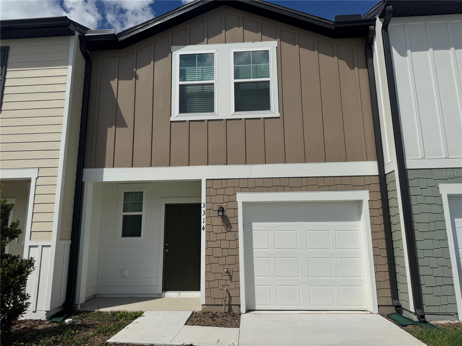 Welcome to Temples Crossing, one of Davenport’s newest communities where modern living meets a prime location.This brand-new corner-unit townhome is truly move-in ready and filled with features you’re sure to love. Being on the end, you’ll enjoy extra privacy with no neighbors on one side, plus peaceful pond views from both the front and the back. Imagine relaxing on your rear patio while overlooking the water and green space the perfect spot to unwind after a long day. The community also offers great amenities, including a pool and mailboxes just a short walk from your front door. Step inside and you’ll notice everything is brand new: fresh flooring throughout, cozy carpet in the bedrooms, and sleek surfaces in the main living and wet areas. The open-concept first floor brings together the kitchen, dining, and living areas, complete with a convenient half bath and direct garage access. Upstairs, the layout is smartly designed — the primary suite is tucked away on one end for privacy, while two additional bedrooms and a full bath are located on the other side. Right in the middle, you’ll find the laundry closet for easy everyday access. This home also comes with a one-car garage featuring an automatic opener, an additional driveway space, and HOA-provided lawn care so you can enjoy low-maintenance living. Built in 2025, you could be the very first to call this beautiful home yours! Contact me today to schedule your private showing — I’d love to walk you through and show you why this townhome is such a special find.