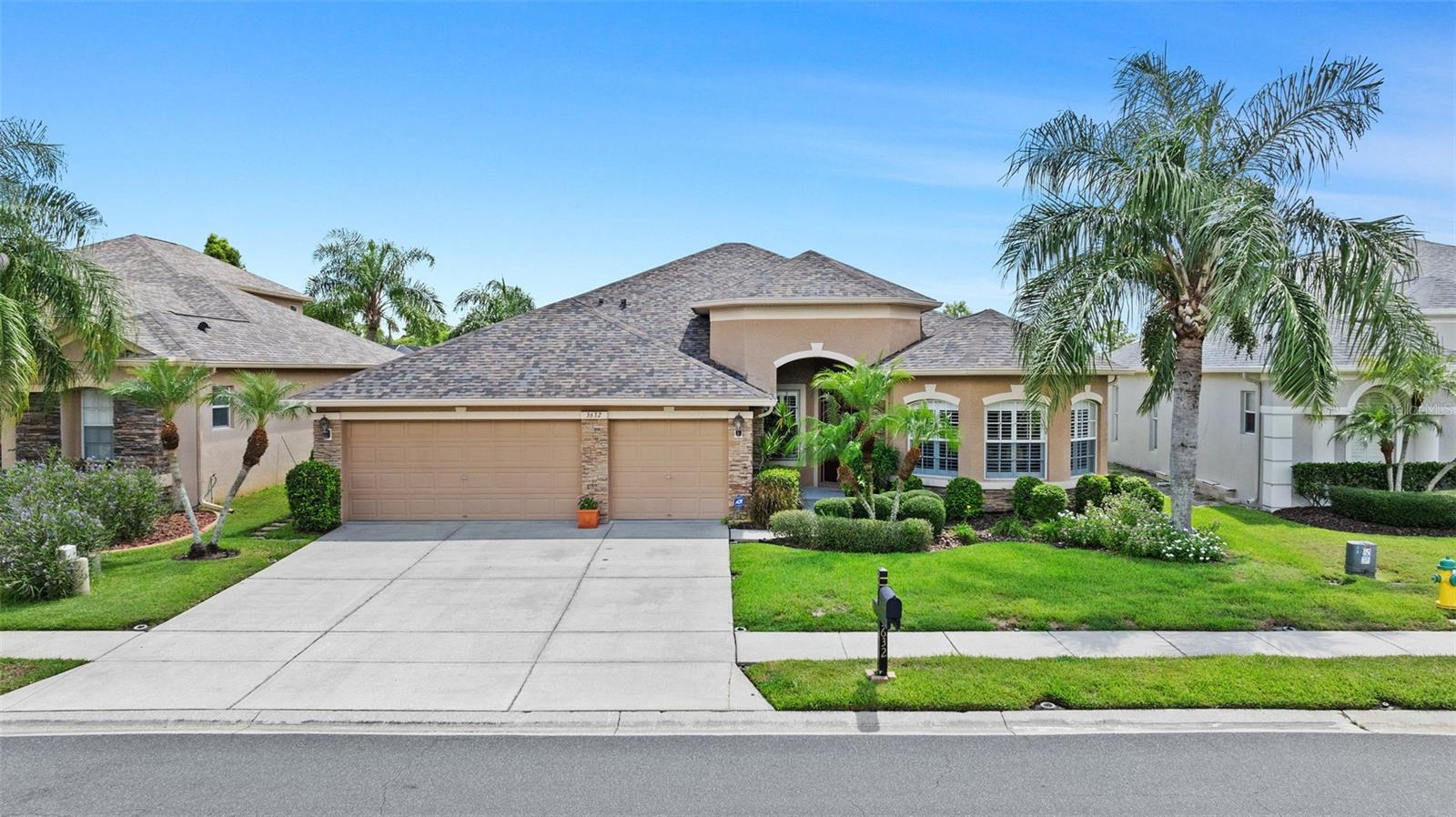 Beautifully and meticulously maintained one-story home, in the gated GOLF COMMUNITY of PLANTATION PALMS, can be your next residence. Impressive 4 bedrooms, 3 bathrooms, 3-car garage PLUS AN OFFICE/DEN is well designed for your living requirements. Backyard faces the 5th hole on the Fairway. Stunning golf view is tranquil and peaceful and far away enough not to hear the golfer's voices and sounds. They are muffled by the trees and the pond. Relax in the screened lanai or swim in the sparkling water in your own private SALT WATER POOL. Pool deck has brick pavers with child protective guards. Upon entering through the 8 feet front insulated metal double doors you will see the living room and dining room. The office/den/library faces the front of the house. Walls throughout are adorned with painted wood chair rails and wall molding trim. Crown molding showcases the high ceiling all around the interior space. The recessed lighting displays a clean and streamlined look which softly illuminates the room(s). Several rooms are embellished with coffered ceiling drawing the eyes up to the added architectural design. PLANTATION SHUTTERS in several rooms add elegance, privacy and energy efficiency. Spacious family room just off the kitchen is perfect for lounging, relaxing and getting comfortable. Features in the kitchen include tall 42 inch maple cabinets with crown molding, corian counters, 2 food pantries, range, refrigerator, dishwasher, microwave, an island, a snack bar and a breakfast nook overlook the pool and golf fairway creating a spectacular morning view to help start your day. Large primary bedroom has oversized windows overlooking the pool plus a door leading into the lanai and pool area. The Ensuite bathroom has double sinks, large walk-in closet, separate tub, walk-in shower and separate private water closet. Three way split showcases one bedroom facing the backyard and a full bathroom with pool door perfect for multi-generational living or guests. The other bedroom has a walk-in closet. On the other side is the next quest bedroom and a full size bathroom on the hall. The laundry room, with washer and dryer included (purchased new in 2024) displays 42 inch cabinets and laundry sink. 3-car over-sized garage has shelfs and plenty of storage space. Additional features include roof replaced in 2023, Water Heater in 2020, A/C Compressor in 2023. Manicured landscaping, low cost HOA fees and NO CDD charges adds to the affordability of owning this residence. Convenient to major highways, expressways, shopping malls, outlet malls, hospitals, dining, entertainment facilities, hockey arena and community recreation parks makes this an ideal place to live. Enjoy the sunny Florida lifestyle in this home. Call today to schedule your private showing.