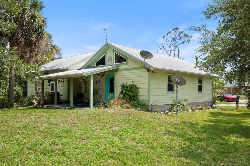 Photo of 7348 Coach Road, Port Charlotte, FL 33981 (MLS # C7512960)