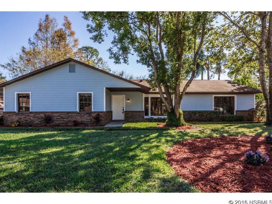 Walk into equity! Priced 20k BELOW Appraised value!! You are going to want to own this stunning completely renovated single family home in sought after, gated Sugar Mill Country Club Community. This gorgeous home is situated on a large 155x100 foot corner lot with mature trees and newer landscaping. This 3 bedroom 2 bathroom home features a new open floor plan with new birch forest gray porcelain tile throughout, a new kitchen featuring stainless steel appliances, white shaker cabinetry with under mount lighting, brushed nickel pulls, summer white granite counters with a large 150"x 54" center island and adjacent wine bar with occupying wine cooler, perfect for entertaining! There is a large master bedroom with a gracious walk in closet adjacent to a bombastic new beautiful master bathroom featuring a double sink with granite, large walk in shower with ocean blue glass tile and frameless glass shower enclosure. This home offers a split floor plan perfect for guests. Included in this complete renovation is a new family/media room with door leading to deck and rear yard. This fantastic home has new hardiboard siding with light blue paint to offset the rich chocolate brown brick.  This home is loaded with too many extras to mention. ;Water: City