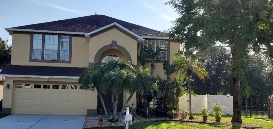 BEAUTIFUL WATERFRONT HOME WITH DOCK! Model perfect! Bring your boat for backyard skiing and fishing! This 5 bedroom 2.5 bath home is located in Waterford at Lake Mango. Formal living, dining, family room. The formal entry welcomes all, as you continue; the formal living is currently used as a game room and is combined with the dining area. High ceilings and palladium windows provide lots of natural light. Spacious family room is complete with built in entertainment center and overlooks the pool. A cook's dream kitchen with custom cherry wood cabinets, granite counter tops, work island, pantry and much more. Upstairs you will enjoy huge master suite with walk in closet. Soak away your worries in the master bath tub; this garden bath includes double vanities and separate shower stall. Four additional bedrooms will accommodate all your friends and family. Inside laundry and oversized garage. Entertainment is easy around this fabulous automated heated pool and raised spa, all screened enclosed for year round use overlooking lake. Do not miss the opportunity to enjoy water skiing, and beautiful sunsets. A/C and pool are fully automated and can be controlled remotely.