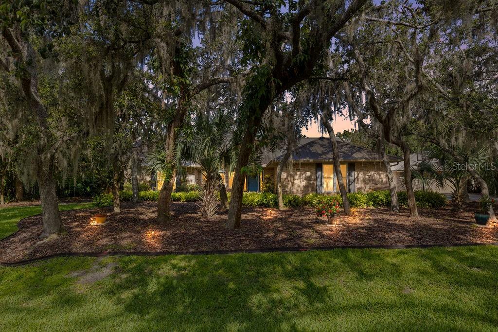 Welcome to your private slice of Florida paradise! Nestled in the quiet and established community of Nellie Oaks, this beautifully maintained custom pool home sits on an oversized lot surrounded by mature trees and serene natural beauty.
This charming neighborhood offers exclusive access to the Clermont Chain of Lakes, where you can enjoy boating, fishing, and water sports right from the private community boat ramp and dock. Spend your weekends exploring the lakes, or cruise by boat to local restaurants, the downtown Clermont farmers market, shops, bars, and community events, a true lake lifestyle at your doorstep.
Step inside to discover a light-filled, open-concept layout with vaulted ceilings and warm finishes throughout. The updated kitchen is a dream for home chefs, featuring granite countertops, stainless steel appliances, and a large breakfast bar overlooking the spacious living and dining areas, ideal for both entertaining and everyday living.
The split floor plan offers privacy and function, with a generous primary suite that includes an oversized walk-in closet and an en suite bath with soaking tub, separate shower, and dual vanities.
Step outside to your screened-in pool and large covered porch, perfect for entertaining and enjoying Florida’s sunshine year-round. The backyard offers plenty of green space, privacy fencing, and room to garden or play. With no rear neighbors in sight, it’s your own peaceful retreat.
Enjoy the tranquility of country-style living, yet you're close to downtown Clermont, the Chain of Lakes, major highways, and 2 hours from beaches on either coast. Bring your boat, RV, or outdoor toys...there’s room for it all!
Don’t miss this rare opportunity to live in a beautifully updated pool home in a charming, tucked-away neighborhood.