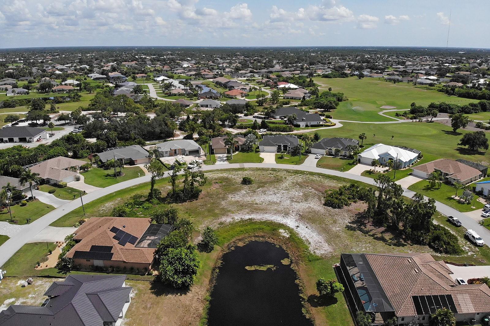 This stunning WATERFRONT lot is located in the golf community of Rotonda West and is NOT IN A FLOOD ZONE! Imagine building your dream home on this conveniently situated lot just outside Long Marsh Golf & Country Club. It offers a peaceful view of the waterway on a unique pie-shaped property with 131 feet of frontage at the front. The neighborhood features a low HOA fee of only $190 annually and is known for its well-maintained, beautiful homes. Medalist Way is a quiet street with minimal traffic, providing easy access to the rest of Rotonda.
Rotonda is a master-planned, deed-restricted community covering over 20,000 acres of lush greenbelts, fairways, ponds, lakes, waterways, and preserves. It boasts 456 acres of common areas, 30 miles of canals, and abundant wildlife. Residents enjoy five golf courses, parks, walking trails, a playground, tennis courts, a country club, a community center, and a boat ramp. Just minutes away, you can explore several beaches, world-class fishing, boating, and the Gulf of Mexico’s San Pedro Island and State Park. Nearby attractions include two baseball stadiums, excellent restaurants, shopping, and more. There are also thousands of acres of state parks and preserves within 10 miles.
A recent survey and a ready-to-build home design are available for this lot, which has access to CITY WATER AND SEWER. Contact us today to start turning your paradise dream into reality!